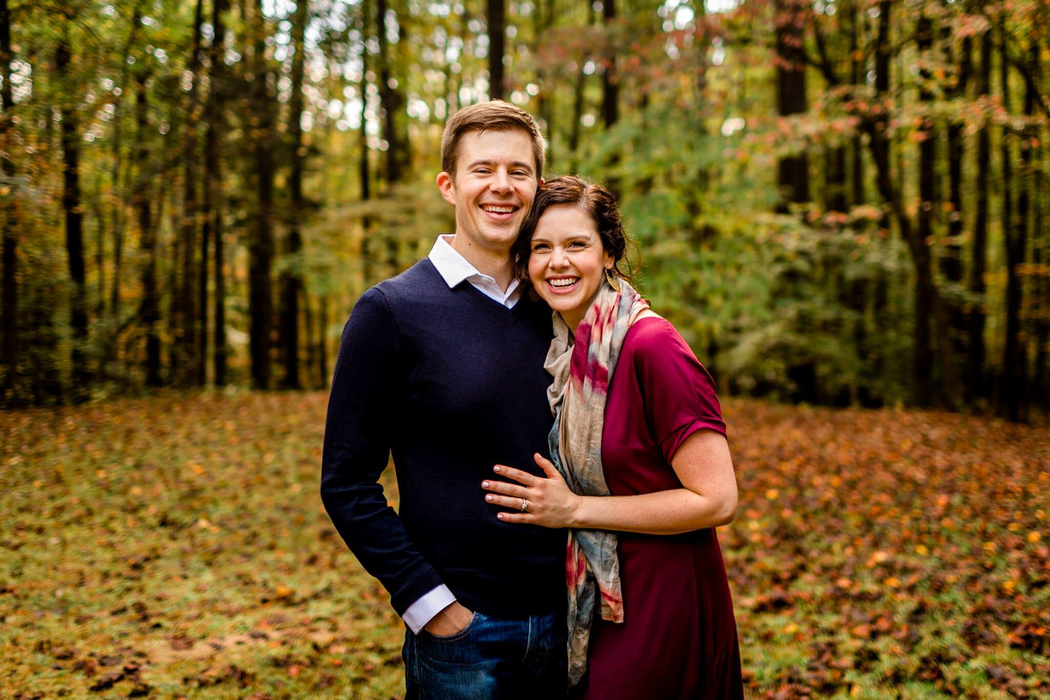 Raleigh Family Photographer | By G. Lin Photography | Umstead Park | Husband and wife hugging and smiling