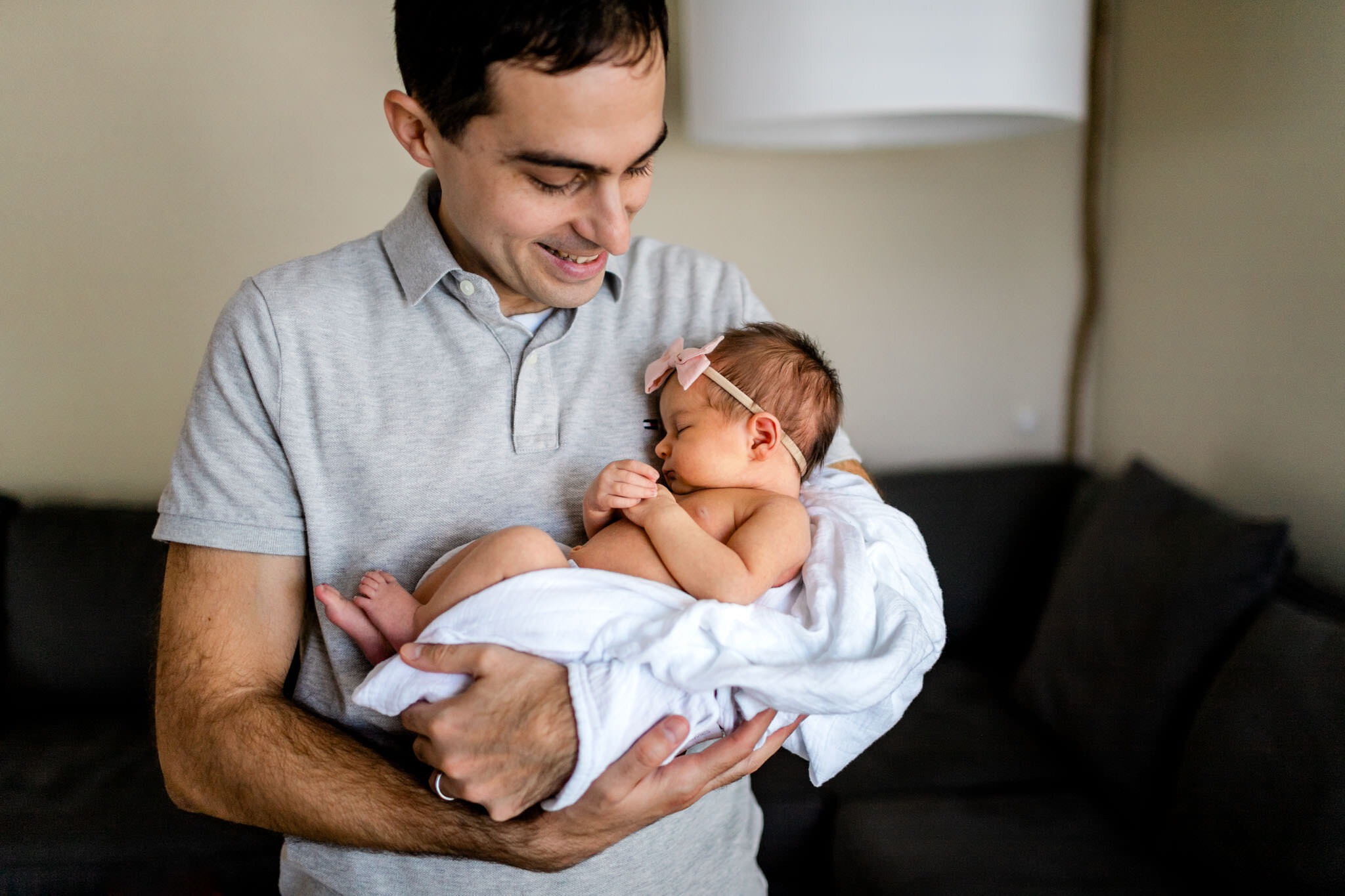Raleigh Newborn Photographer | By G. Lin Photography | Father holding baby girl in living room