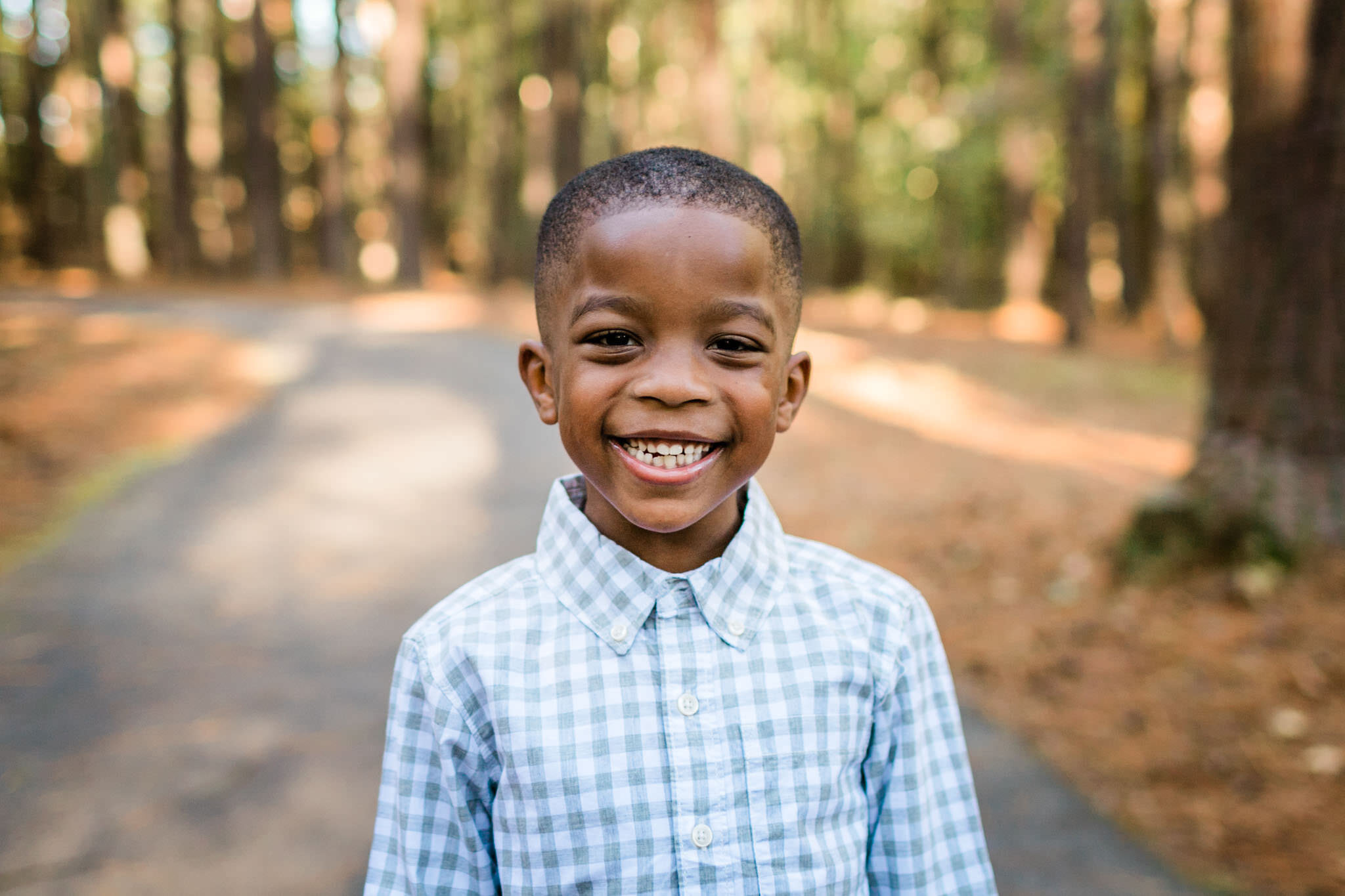 Raleigh Family Photographer | By G. Lin Photography | Umstead Park | Young boy smiling