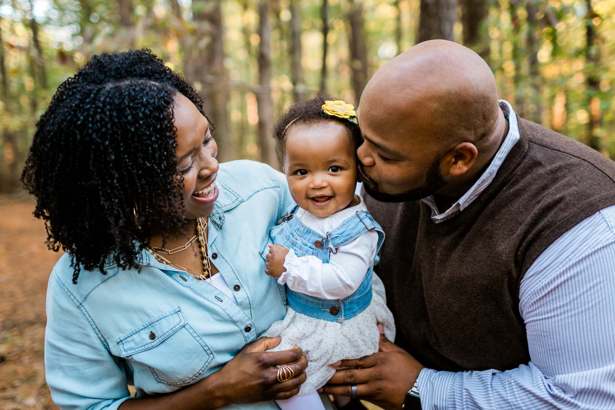 Raleigh Family Photographer | By G. Lin Photography | Umstead Park | Father kissing baby girl on the cheek