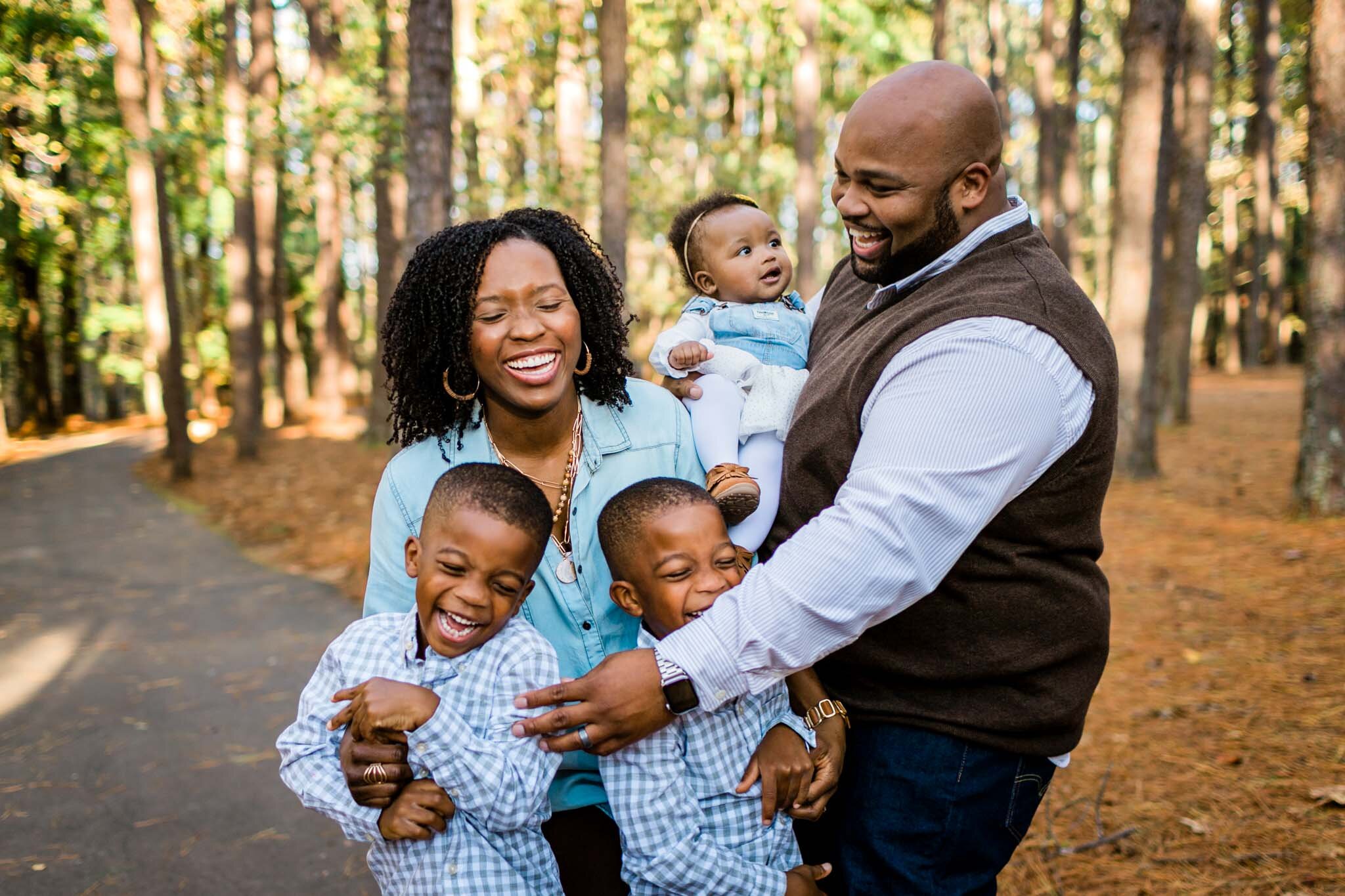 Raleigh Family Photographer | By G. Lin Photography | Umstead Park | Family laughing and tickling one another
