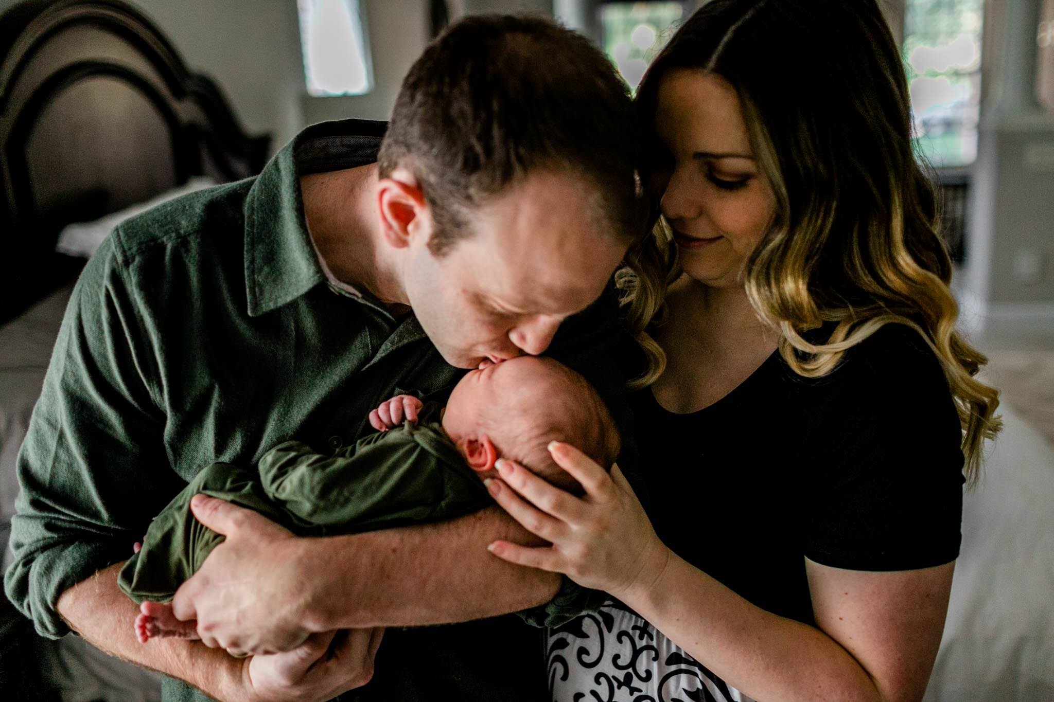 Raleigh Newborn Photographer | By G. Lin Photography | Father kissing baby boy on the head