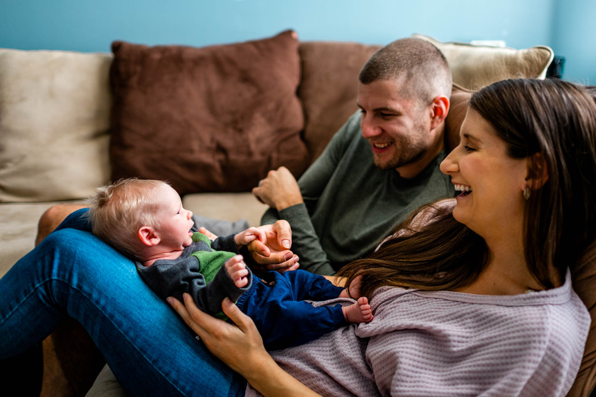 Durham Newborn Photographer | By G. Lin Photography | New parents looking at baby