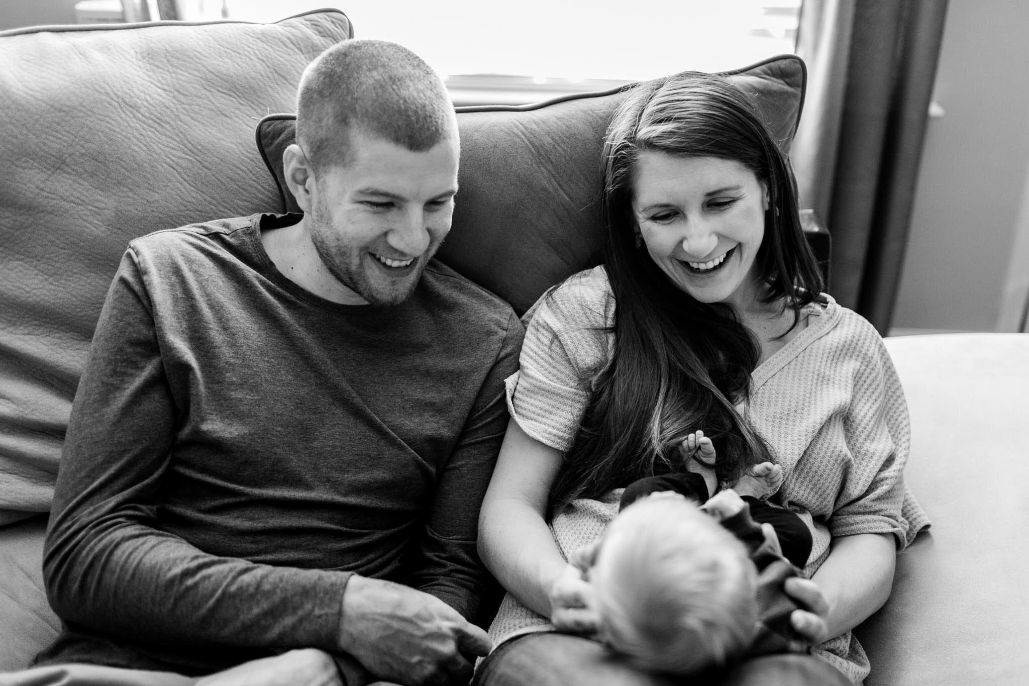 Durham Newborn Photographer | By G. Lin Photography | Black and white photo of parents looking at baby