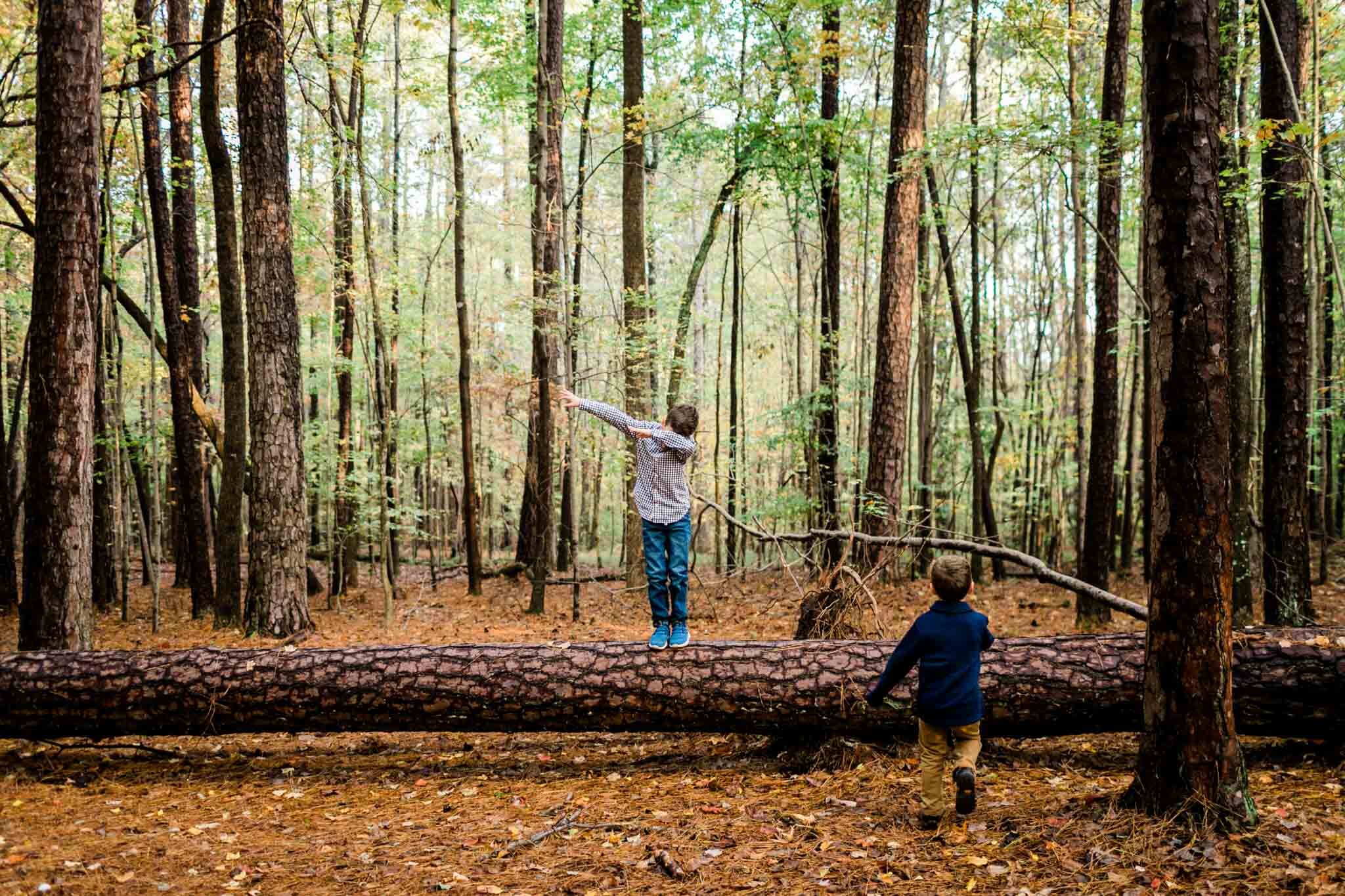 Raleigh Family Photographer | By G. Lin Photography | Umstead Park | Young boy standing on log