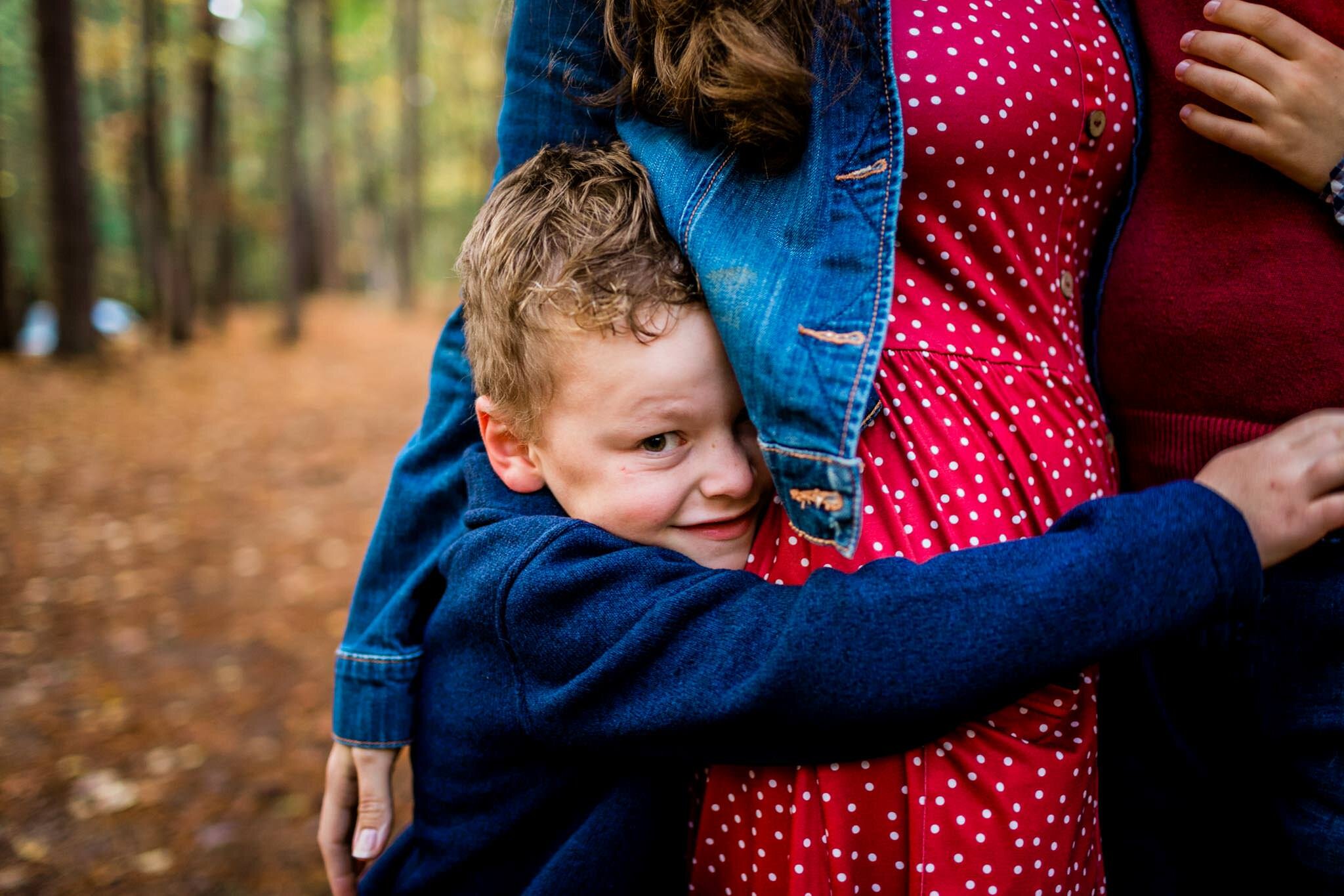 Raleigh Family Photographer | By G. Lin Photography | Umstead Park | Young boy hugging mom
