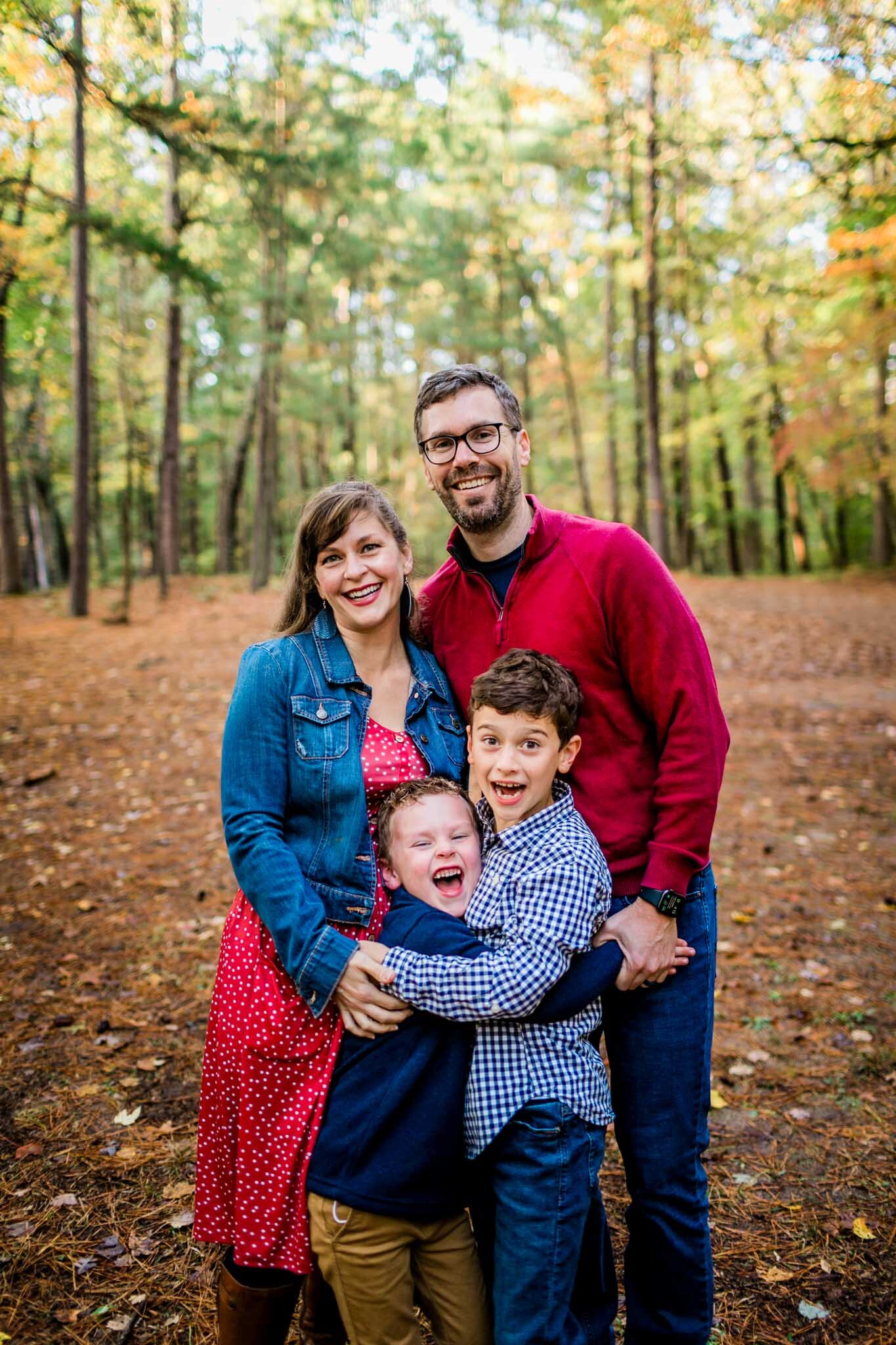 Raleigh Family Photographer | By G. Lin Photography | Umstead Park | Fall family portrait outdoors wearing red and navy