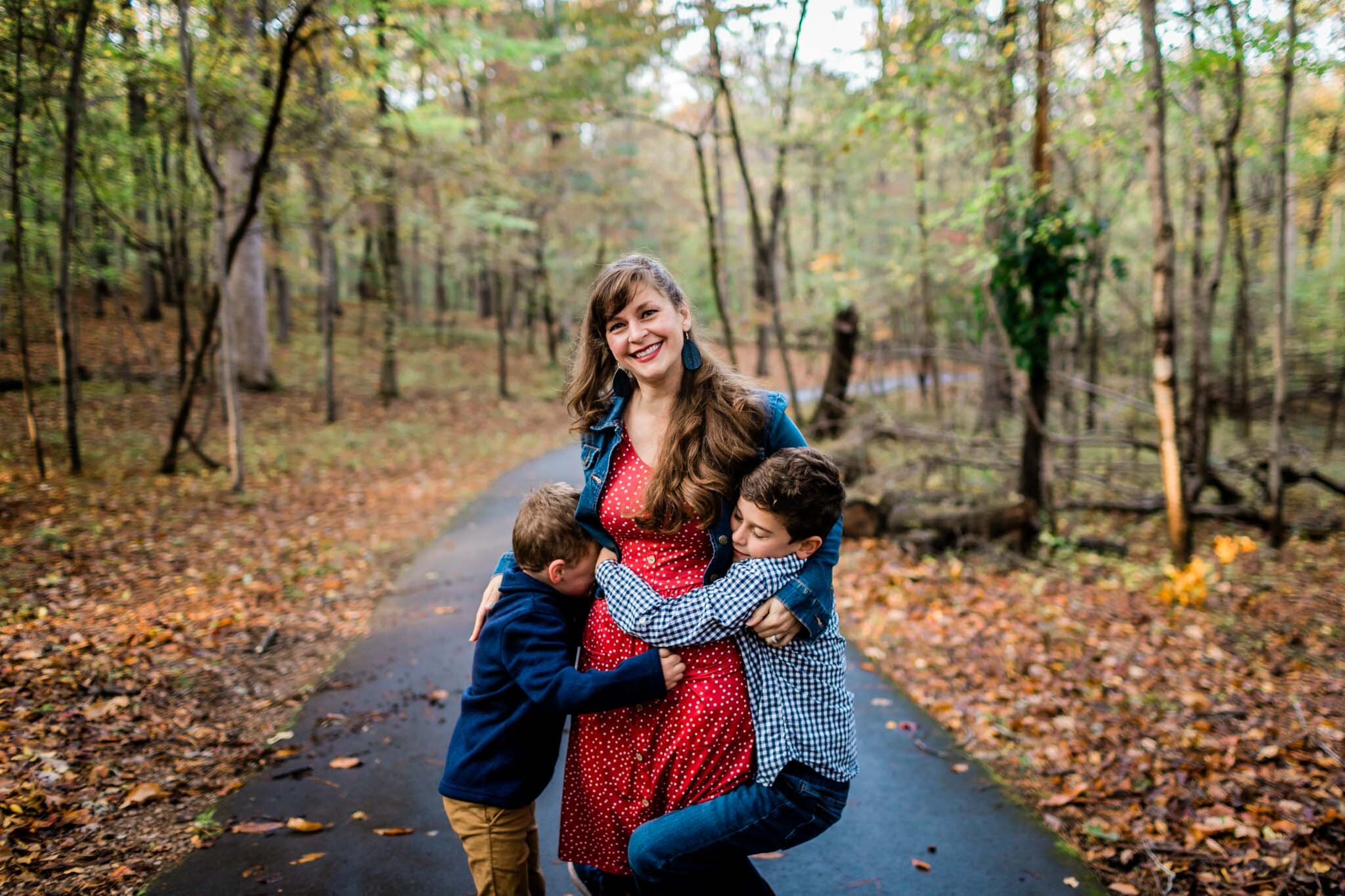 Raleigh Family Photographer | By G. Lin Photography | Umstead Park | Two brothers giving mom a hug
