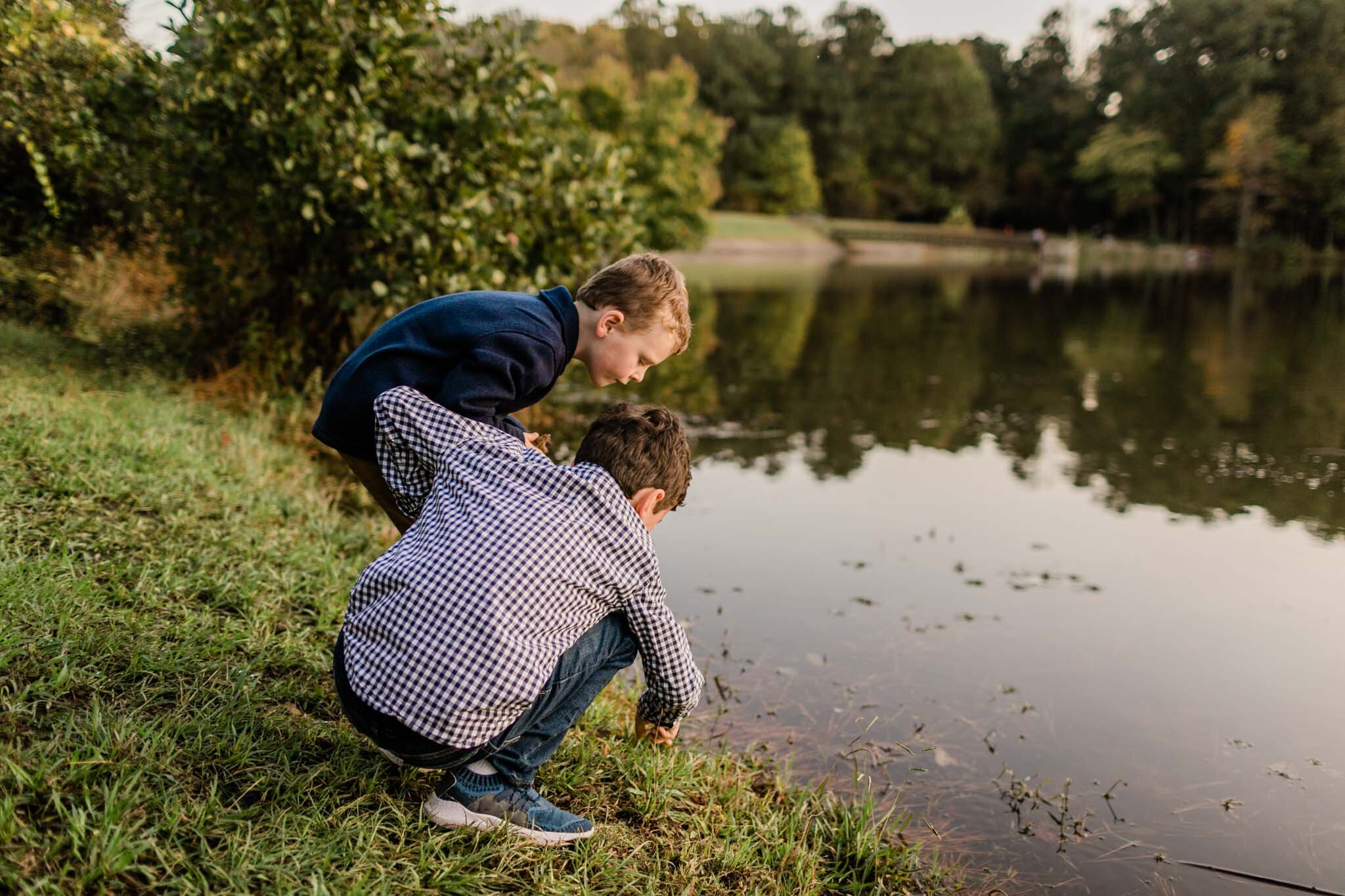 Raleigh Family Photographer | By G. Lin Photography | Umstead Park | Two young boys standing by lake