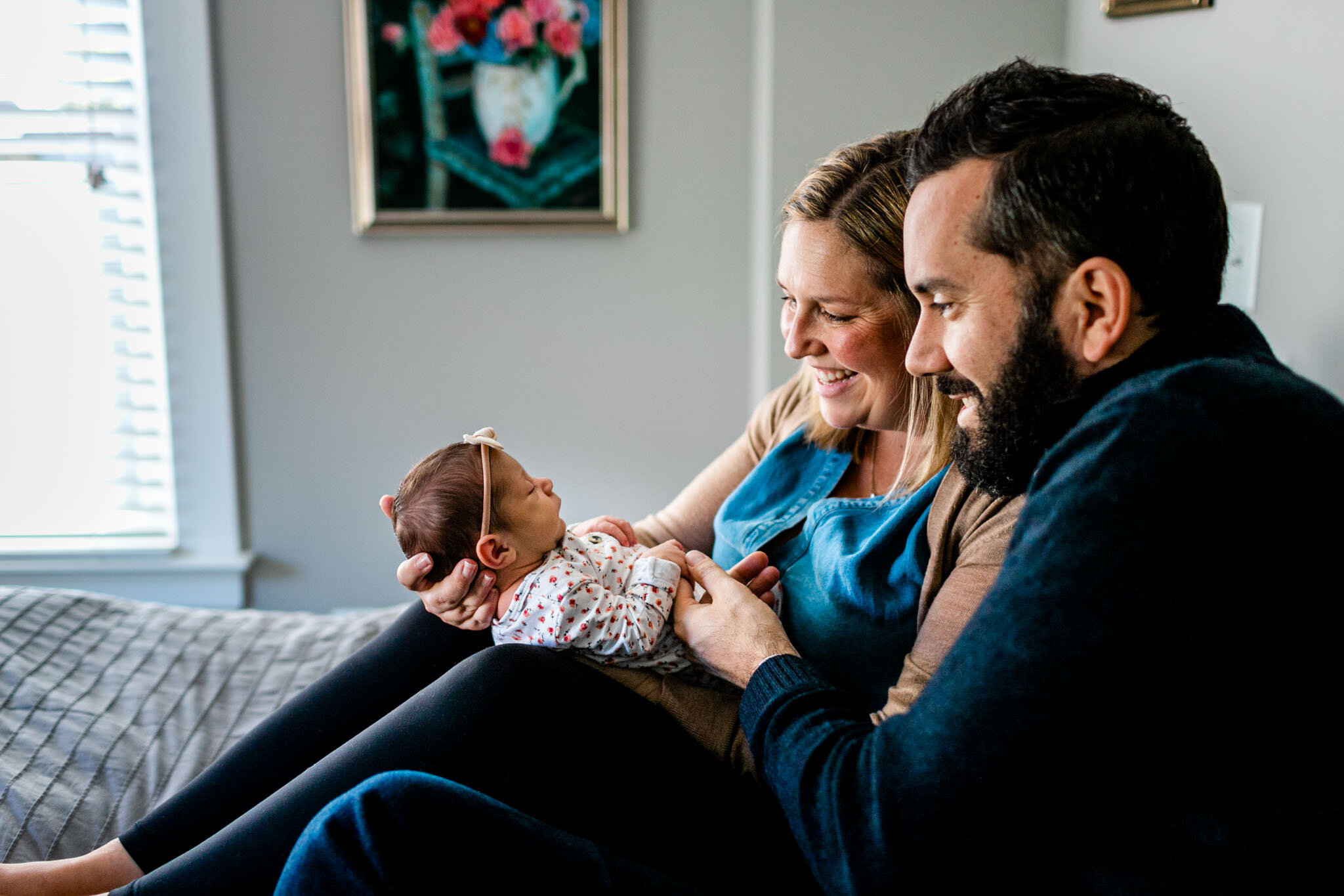 Durham Newborn Photographer | By G. Lin Photography | Parents looking at baby girl