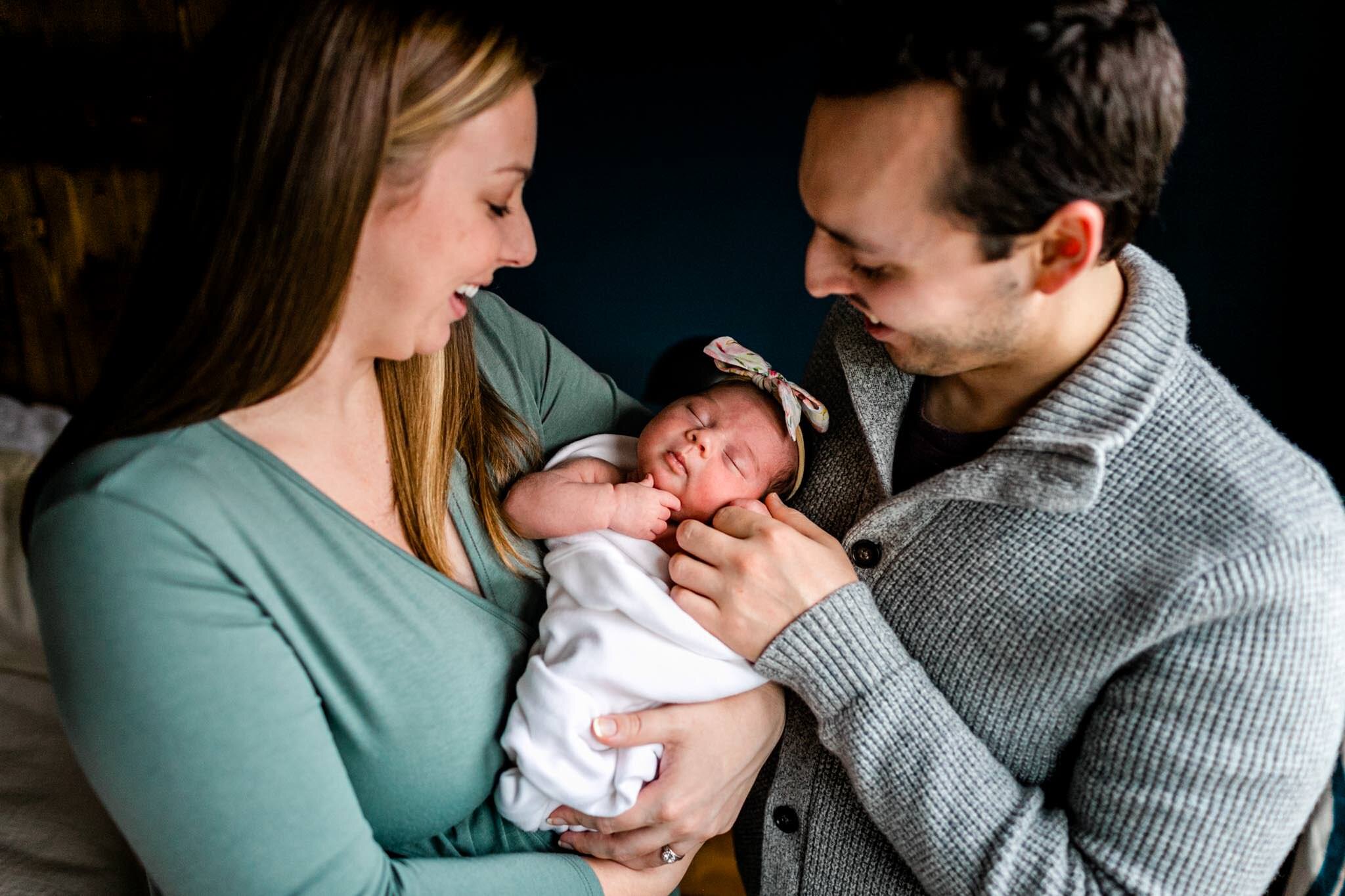 Durham Newborn Photographer | By G. Lin Photography | Parents holding and smiling at baby