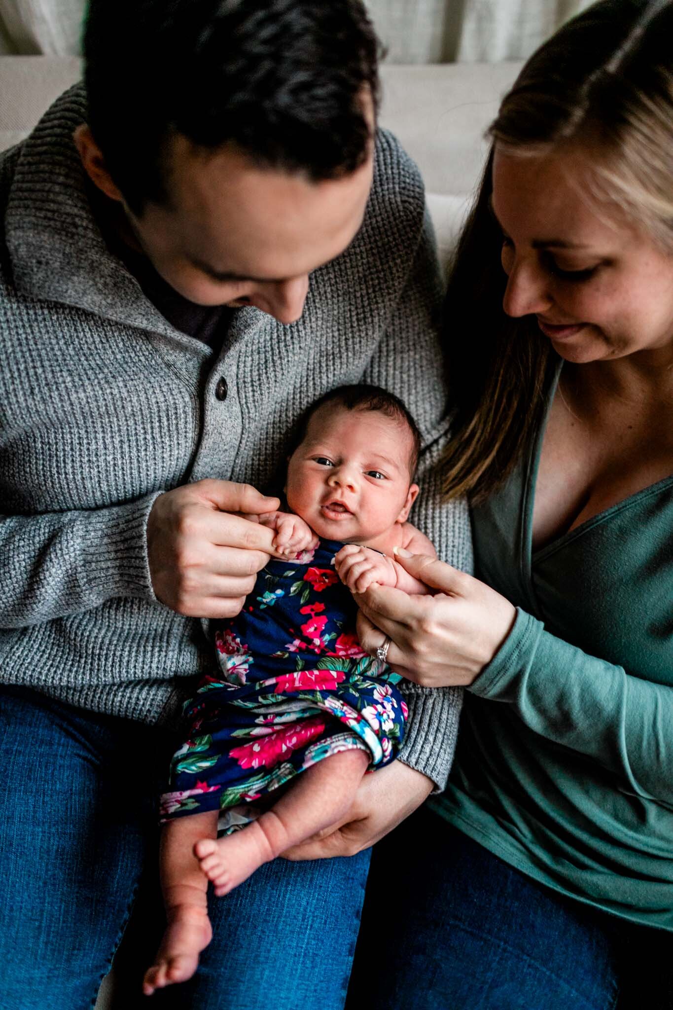 Durham Newborn Photographer | By G. Lin Photography | Parents holding baby girl's hands