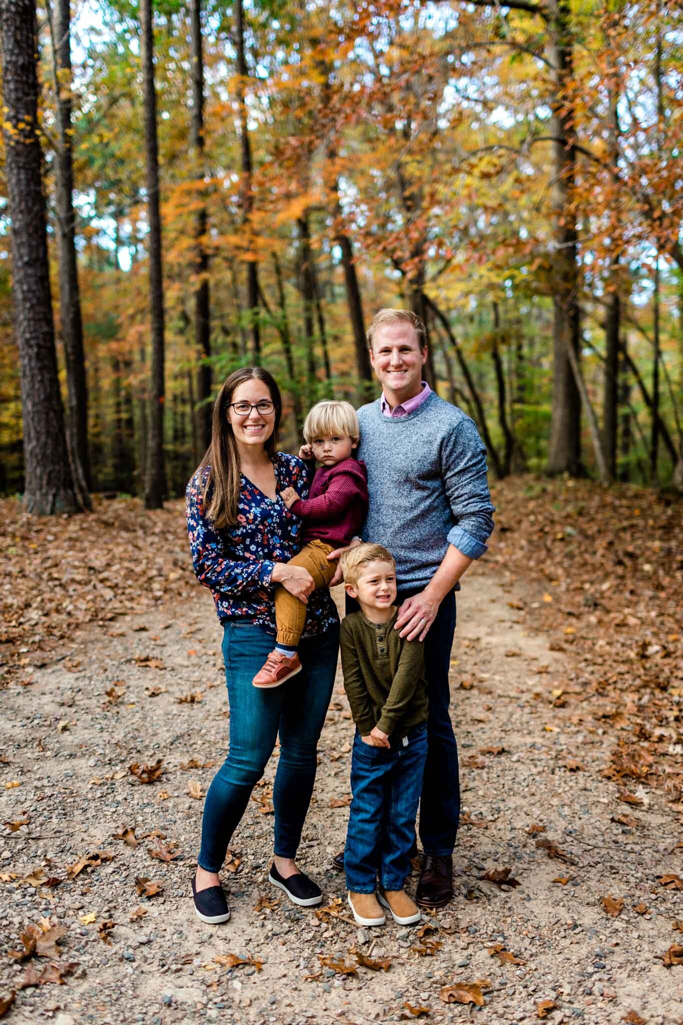 Raleigh Family Photographer at Umstead Park | By G. Lin Photography | Fall family photo with orange leaves in background