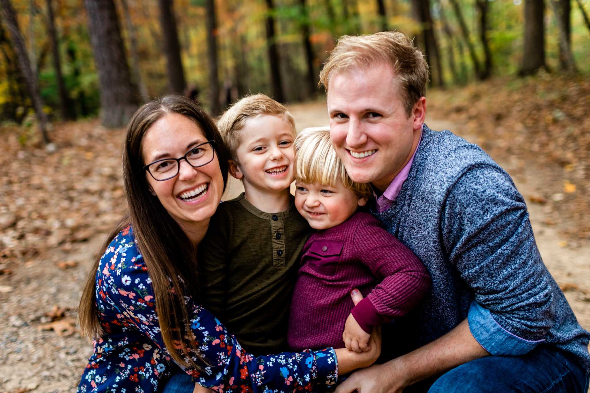 Raleigh Family Photographer at Umstead Park | By G. Lin Photography | Happy family smiling and hugging together