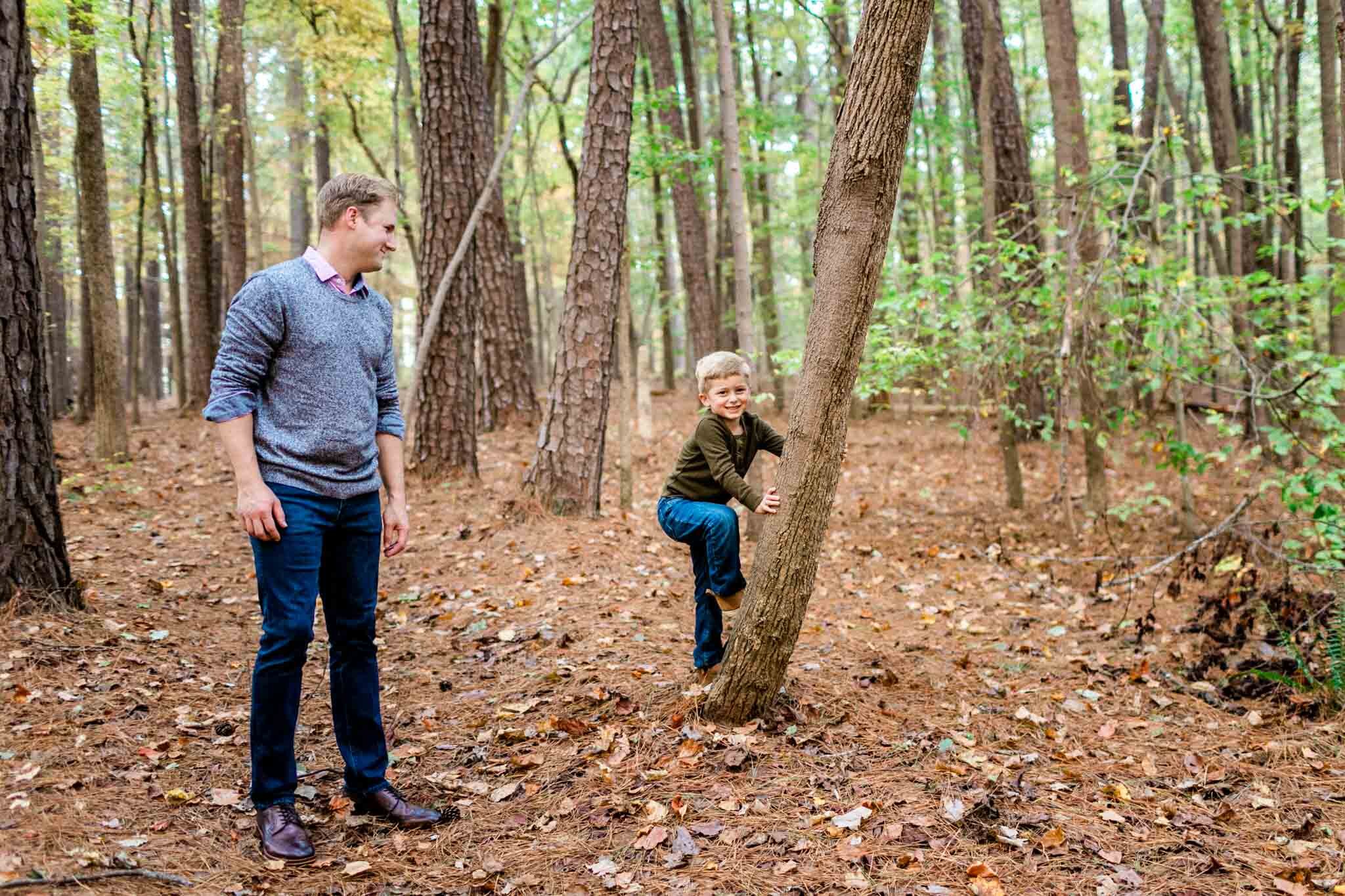 Raleigh Family Photographer at Umstead Park | By G. Lin Photography | Young boy climbing tree