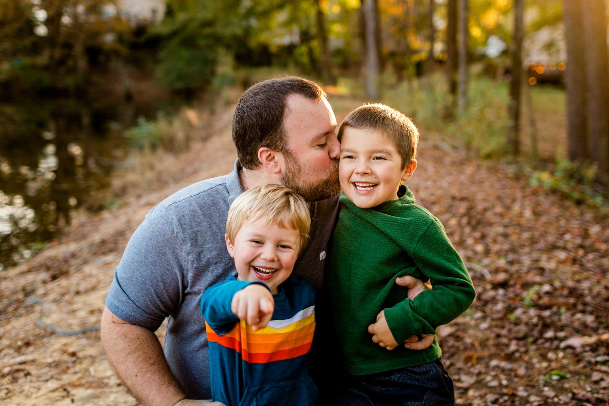 Apex Family Photographer | By G. Lin Photography | Dad smiling and kissing sons