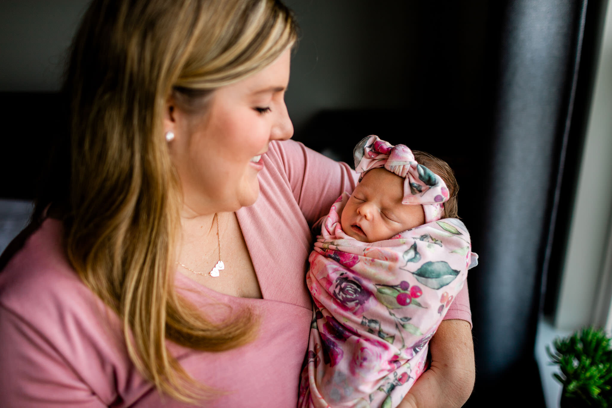 Raleigh Newborn Photographer | By G. Lin Photography | Mother holding baby girl next to window