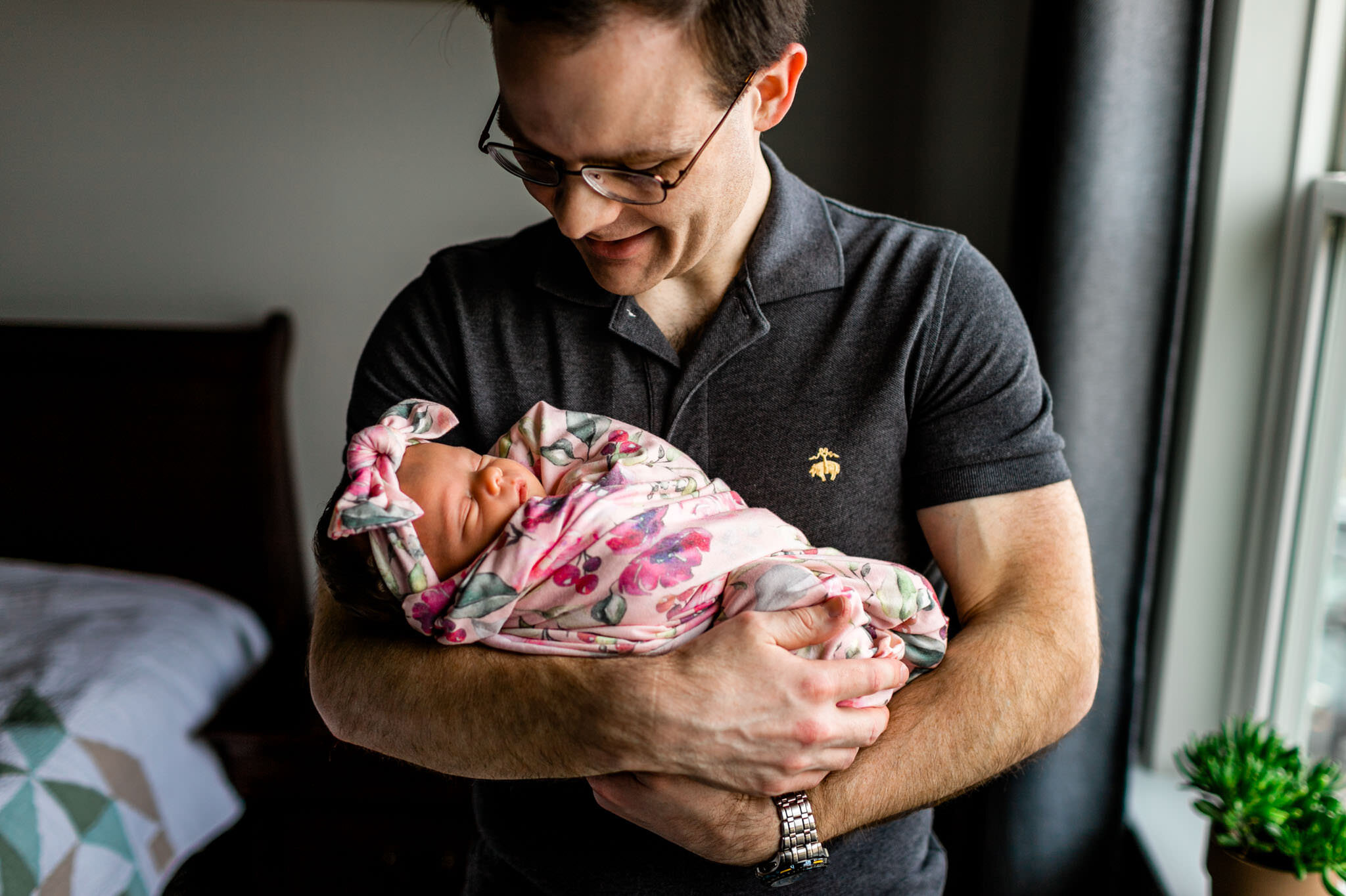 Raleigh Newborn Photographer | By G. Lin Photography | Father holding baby girl next to window