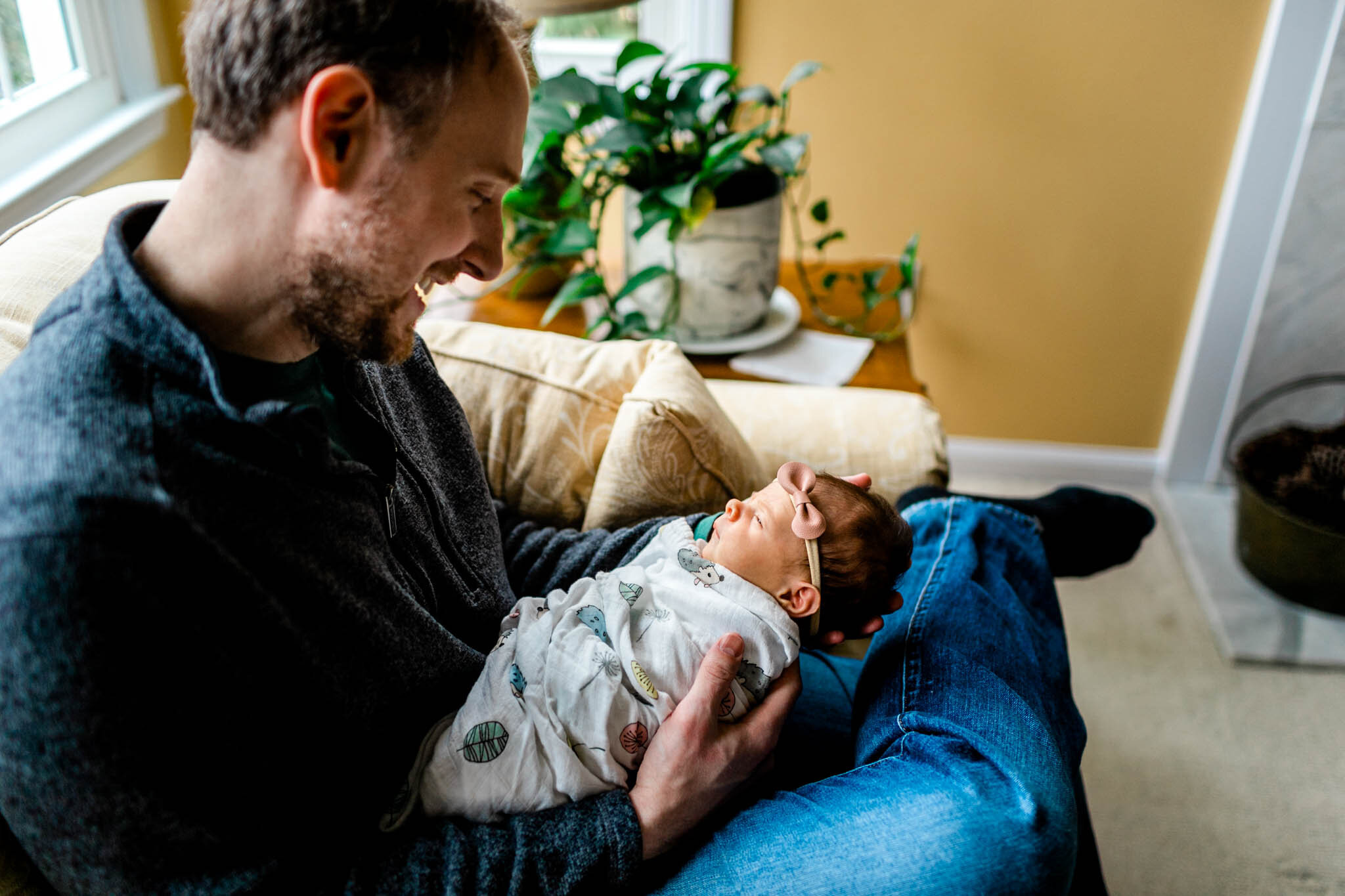 Durham Newborn Photographer | By G. Lin Photography | Man looking down at baby girl and smiling