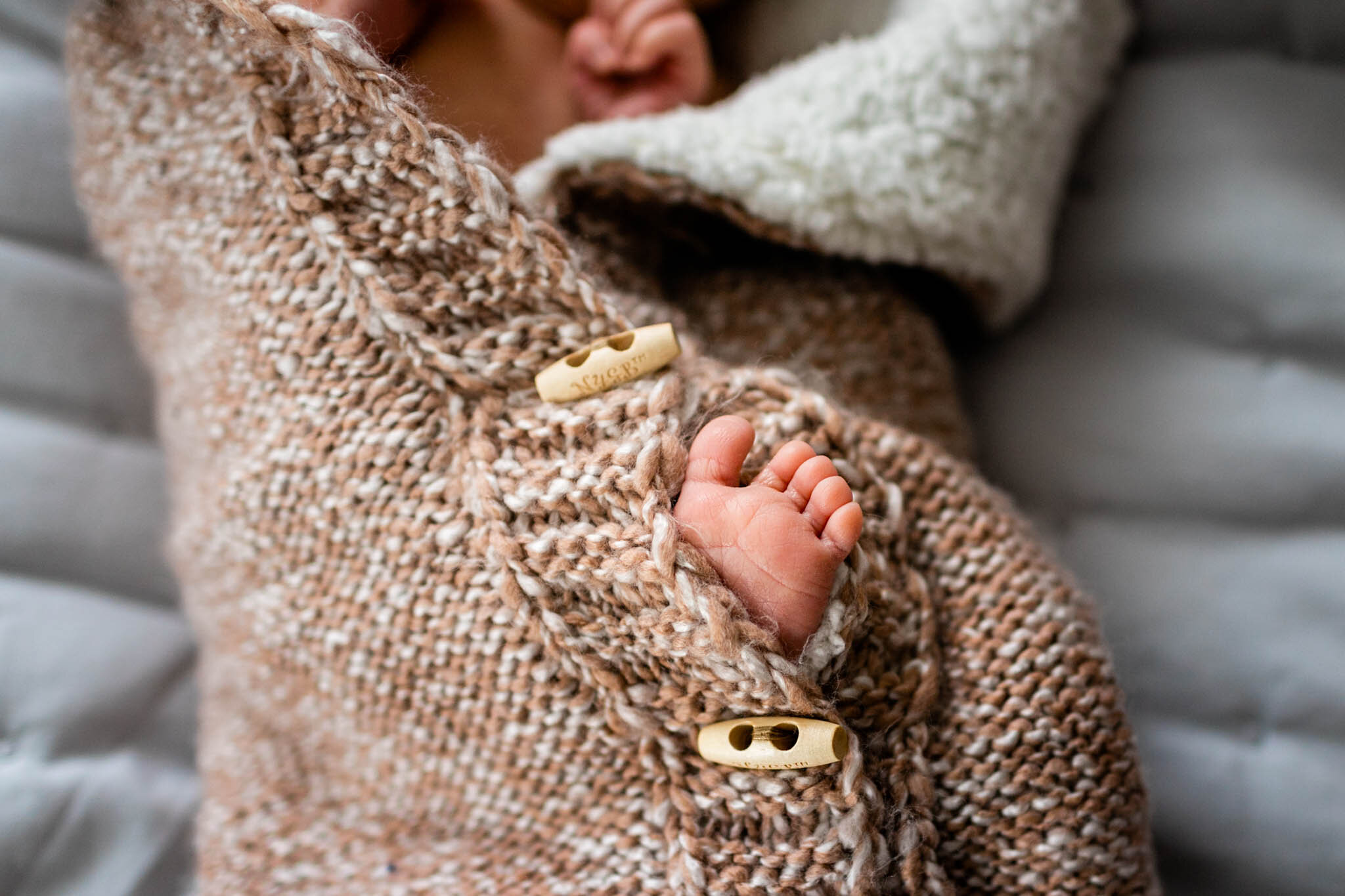 Durham Newborn Photographer | By G. Lin Photography | Baby's toes poking out of swaddle