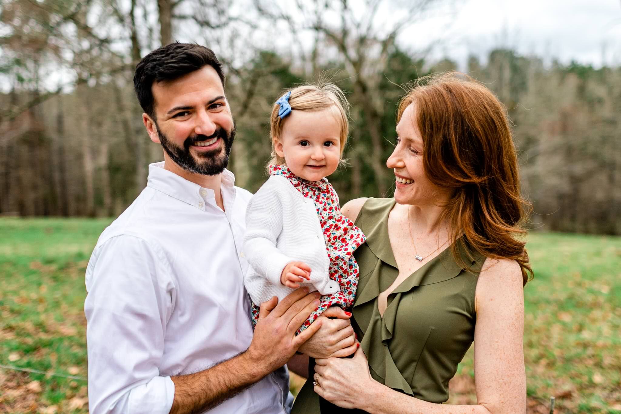 Durham Family Photographer | By G. Lin Photography | Match Day | Husband and wife holding toddler girl