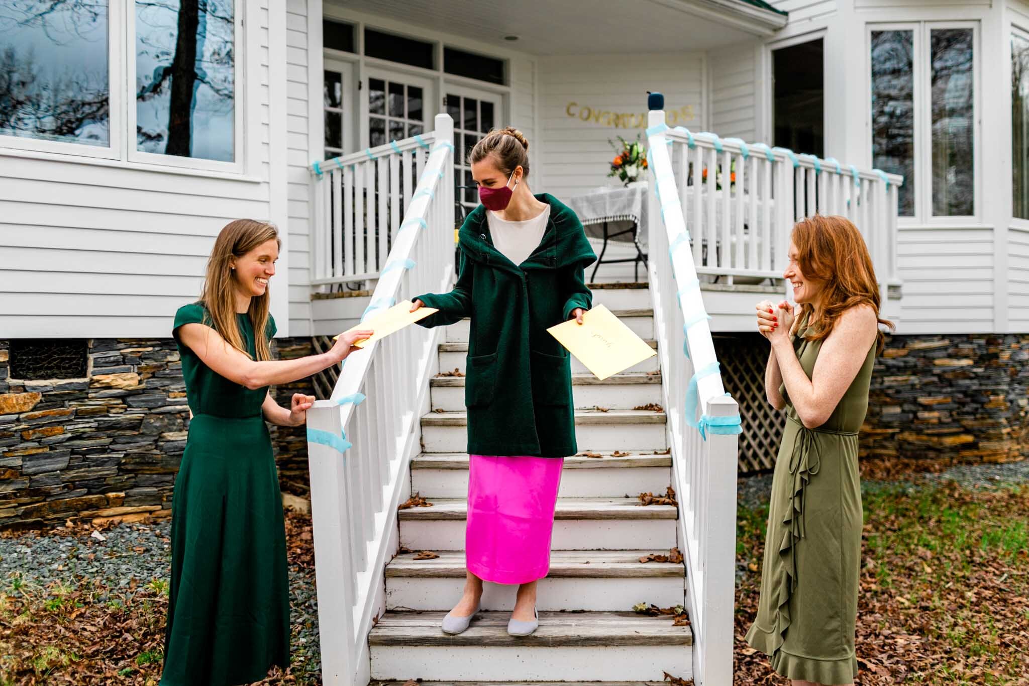 Durham Family Photographer | By G. Lin Photography | Match Day | Woman handing envelopes to two other women