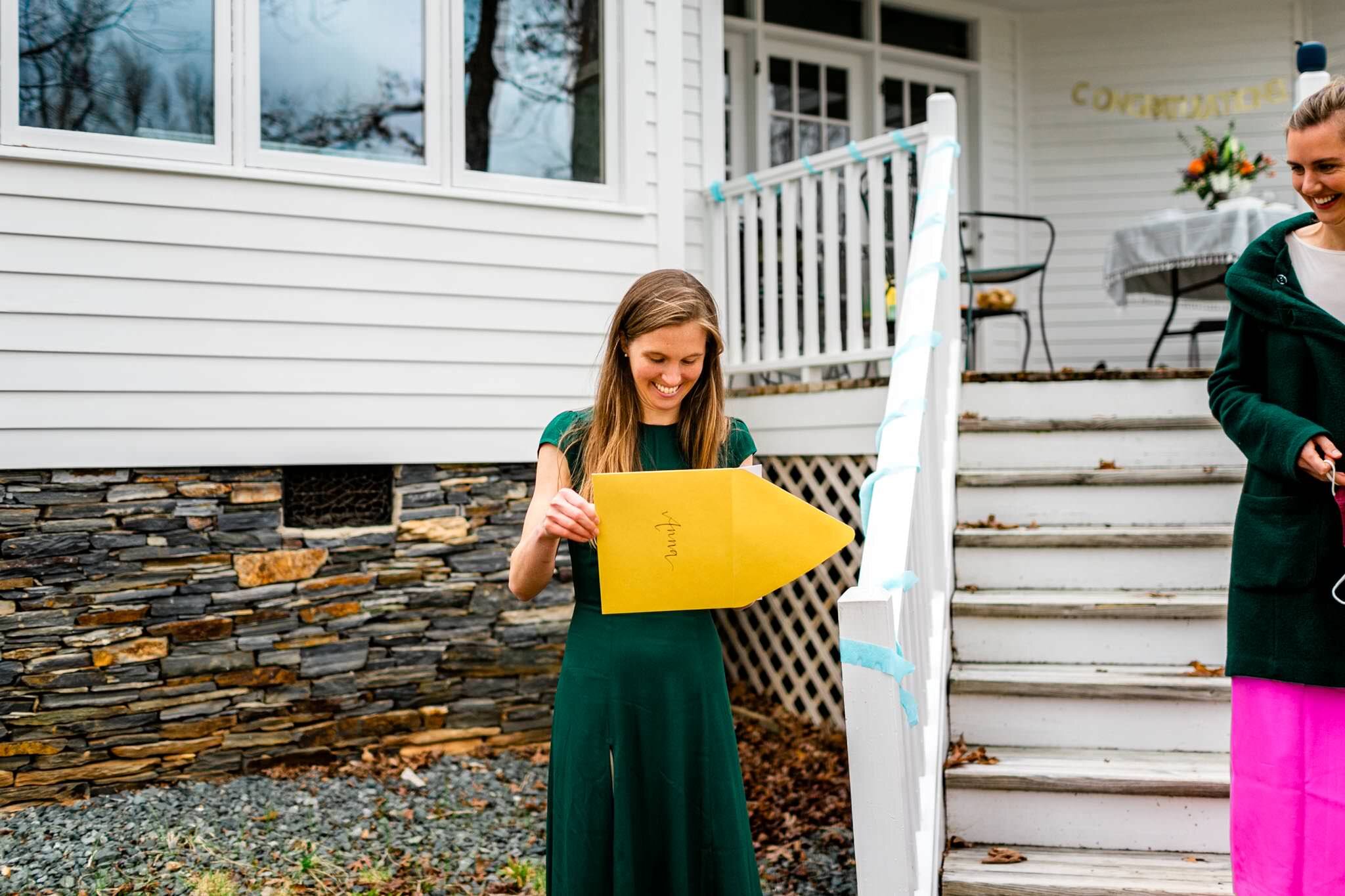 Durham Family Photographer | By G. Lin Photography | Match Day | Woman opening envelope