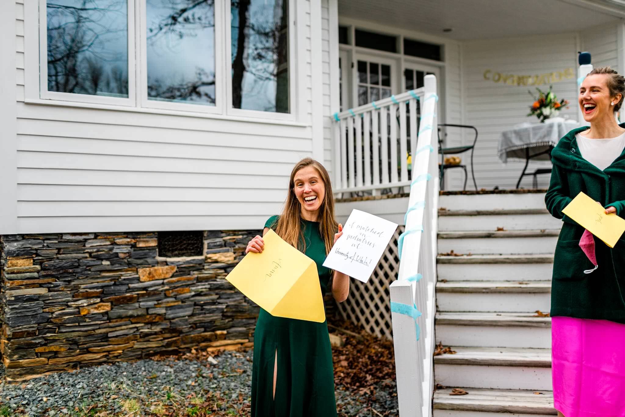 Durham Family Photographer | By G. Lin Photography | Match Day | Woman smiling and laughing while holding letter