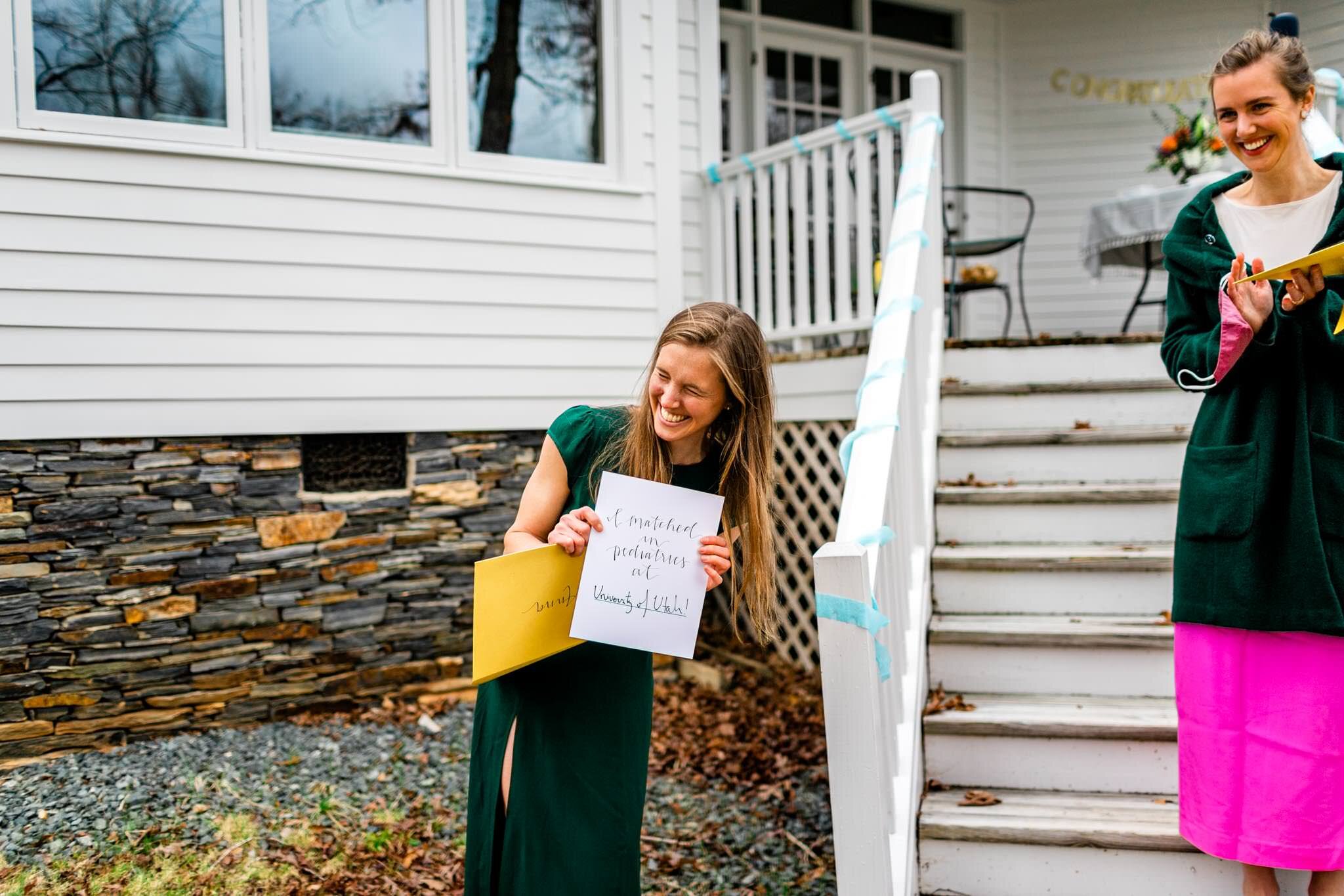 Durham Family Photographer | By G. Lin Photography | Match Day | Woman smiling and laughing while holding letter