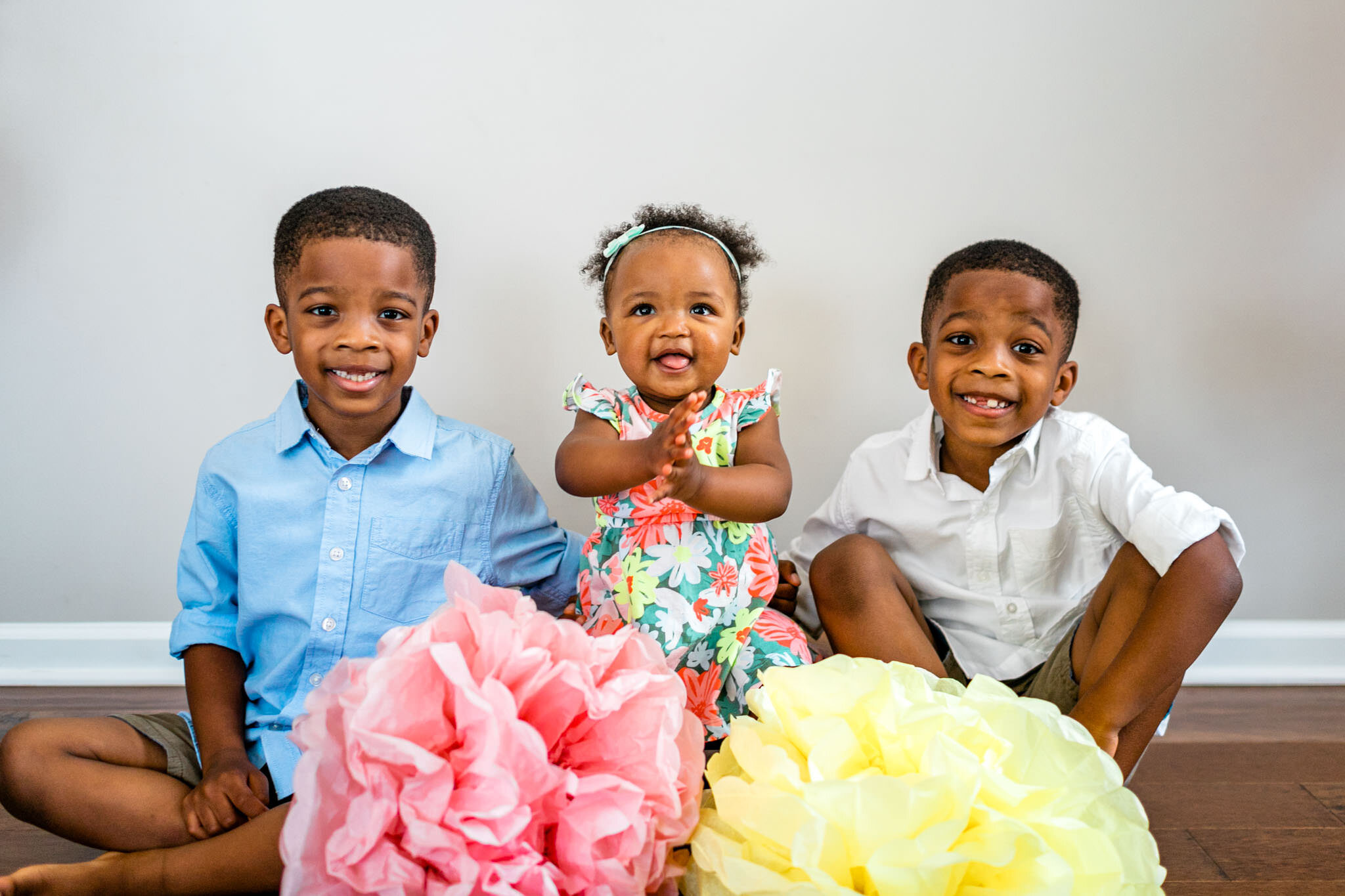 Durham Family Photographer | By G. Lin Photography | Baby girl sitting between two brothers on the floor