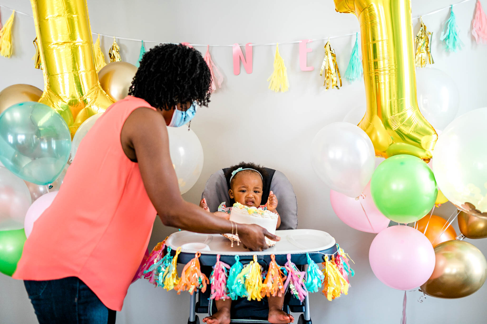 Durham Family Photographer | By G. Lin Photography | First Birthday celebration with mom giving cake to baby girl
