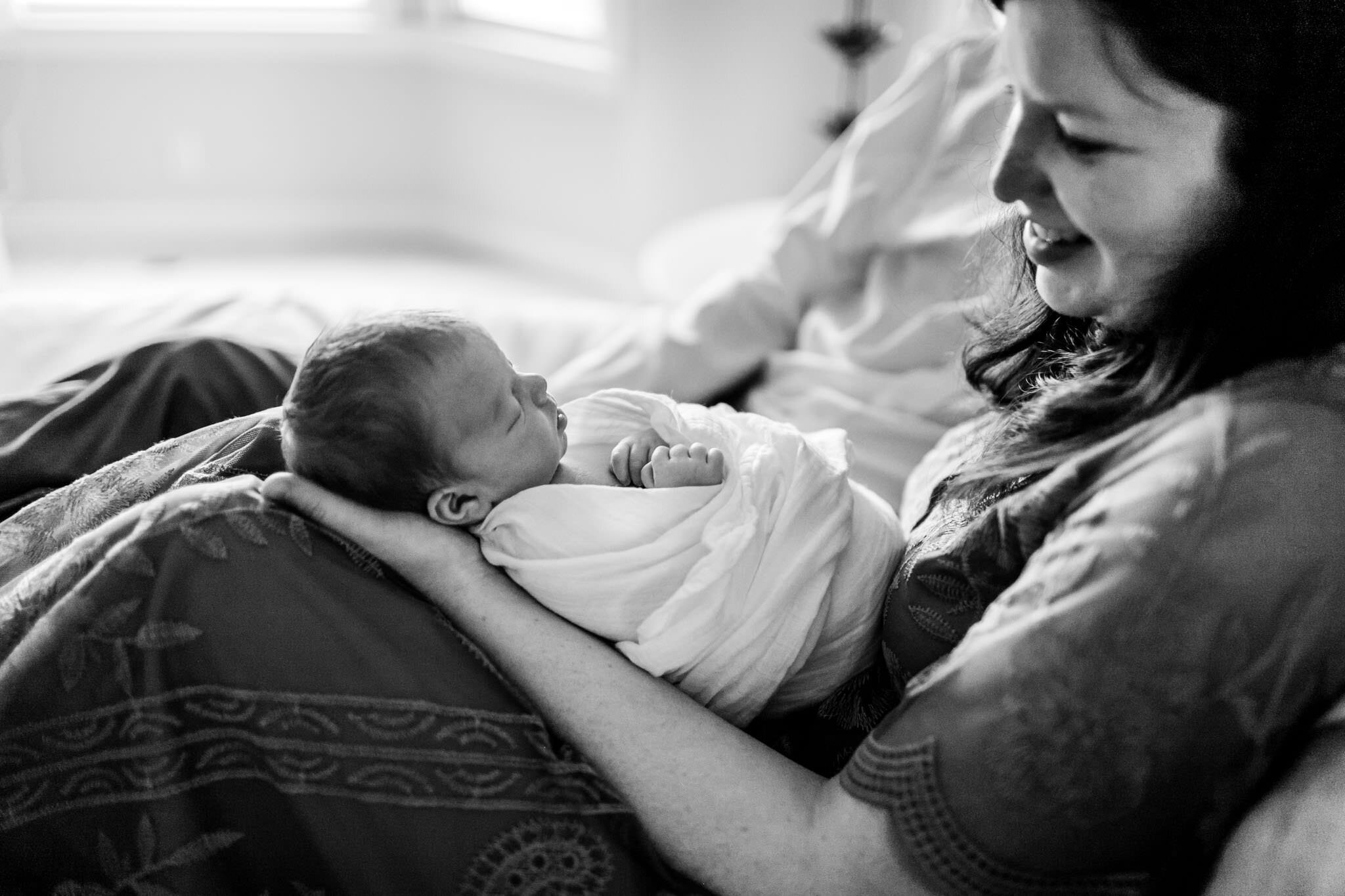 Durham Newborn Photographer | By G. Lin Photography | Black and white photo of mother holding baby