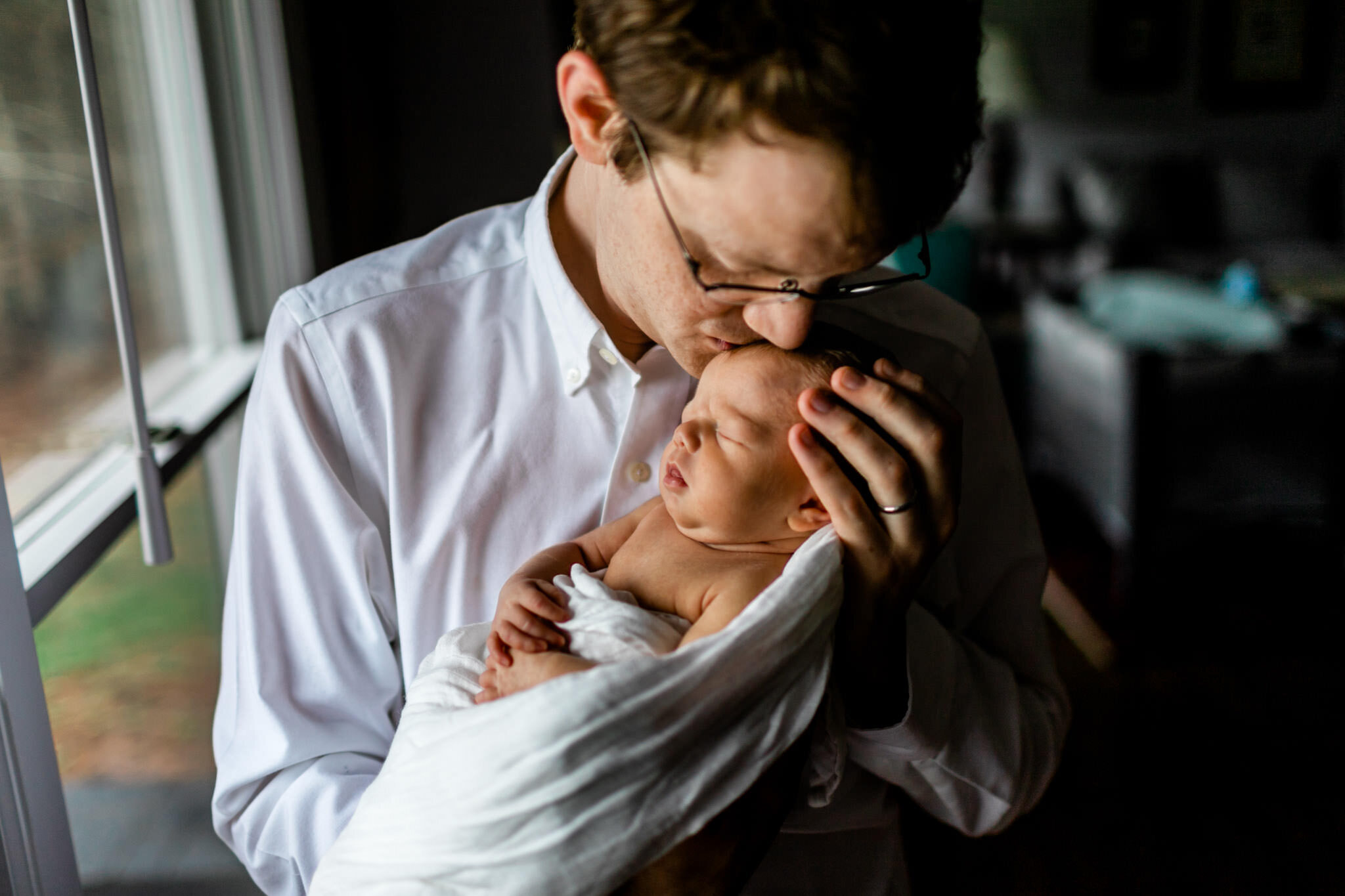 Durham Newborn Photographer | By G. Lin Photography | Father kissing baby boy