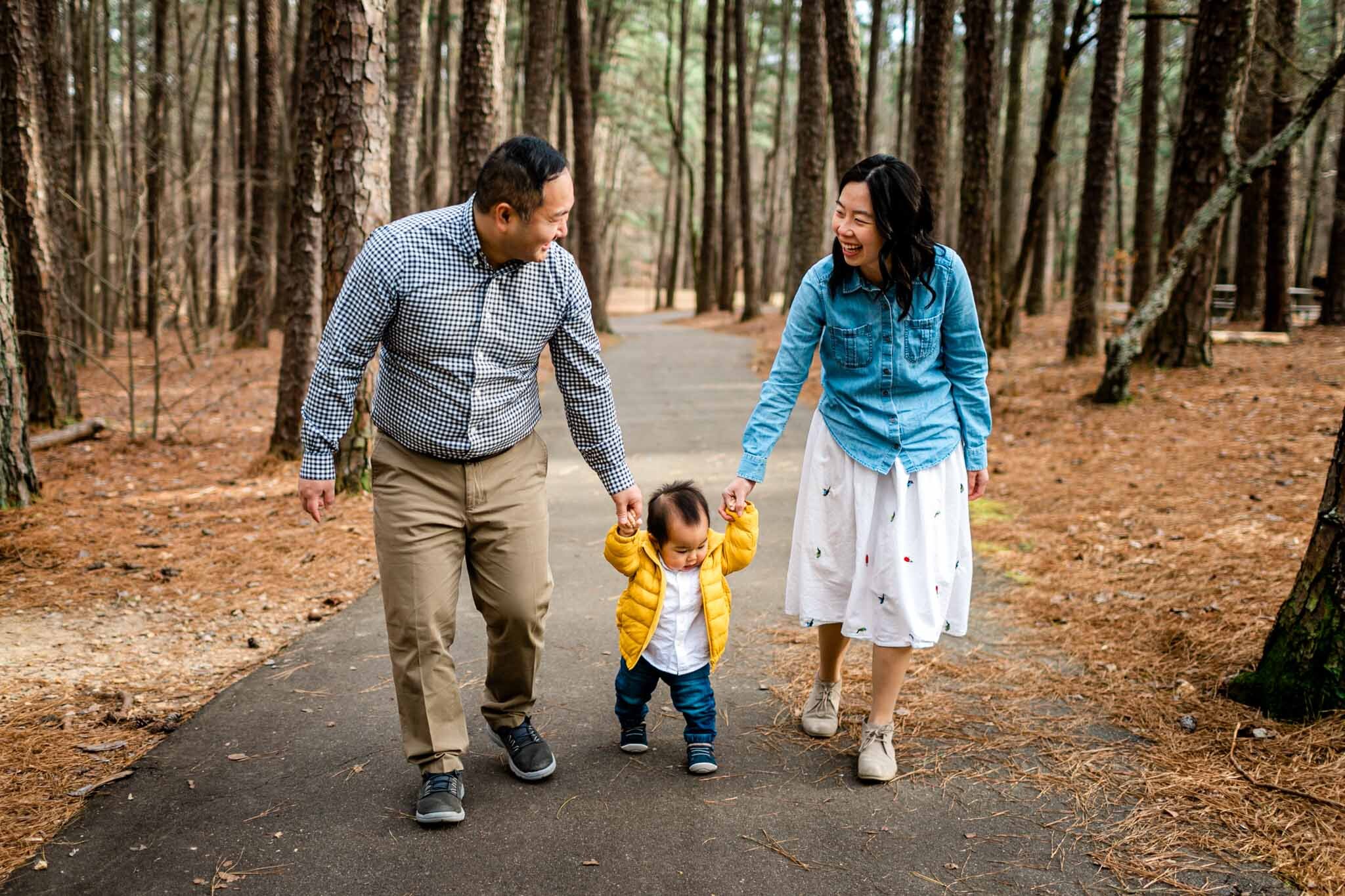 Raleigh Family Photographer | By G. Lin Photography | Umstead Park | Family walking together in forest