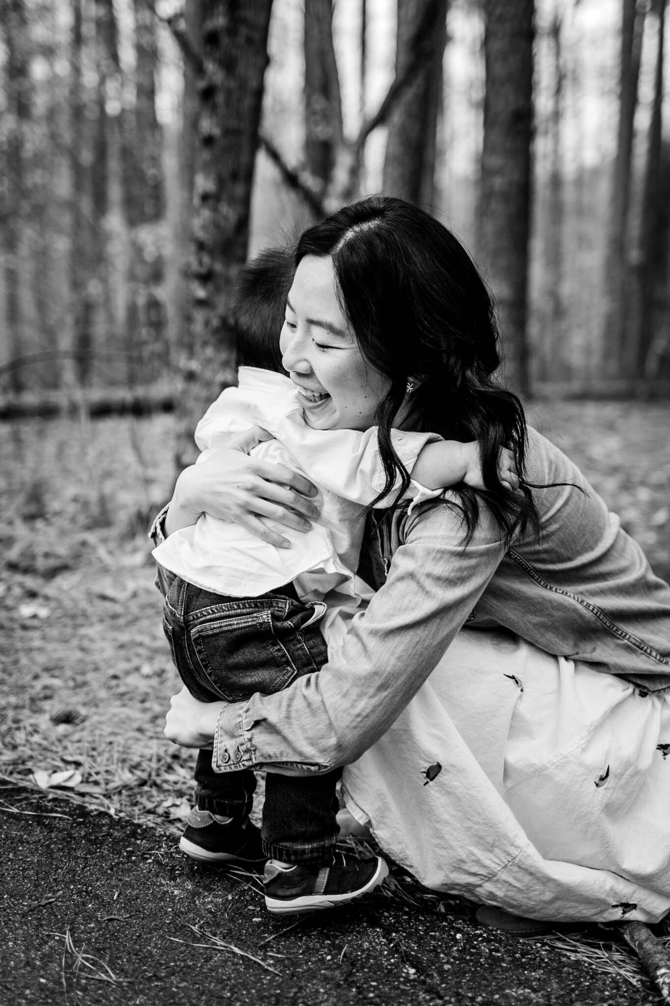Raleigh Family Photographer | By G. Lin Photography | Umstead Park | Mom hugging baby