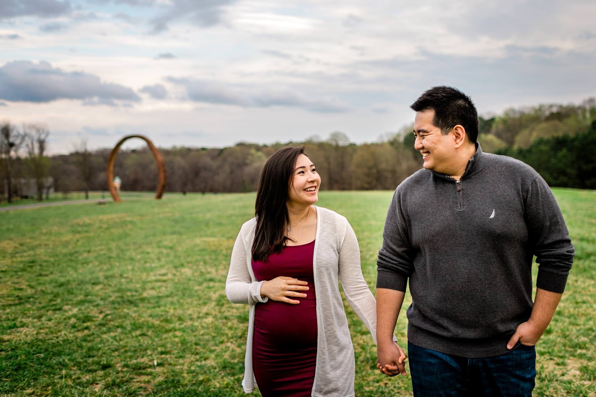 Raleigh Maternity Photographer | By G. Lin Photography | NC Museum of Art | Couple walking on open field
