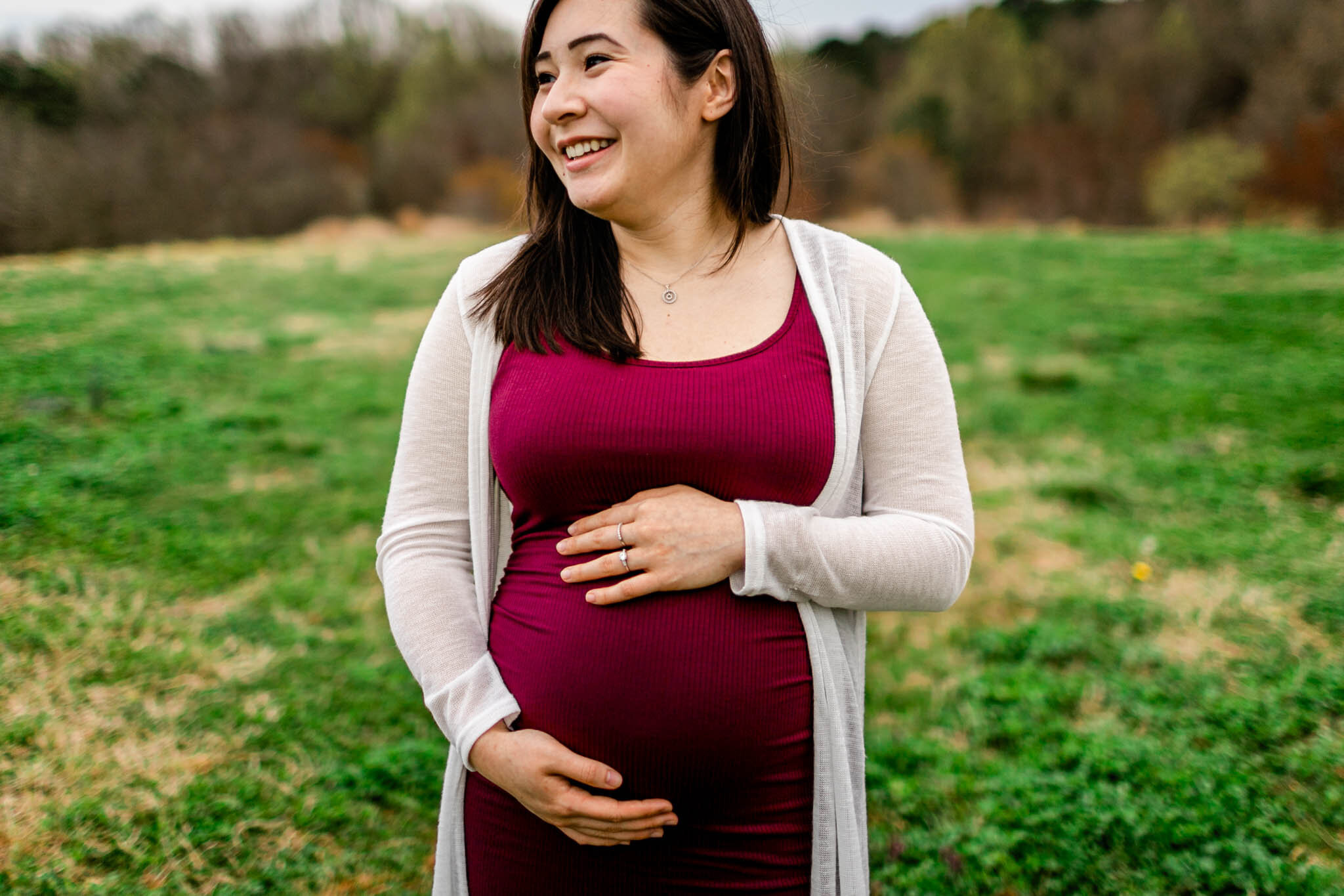 Raleigh Maternity Photographer | By G. Lin Photography | NC Museum of Art | Candid maternity portrait of mother smiling