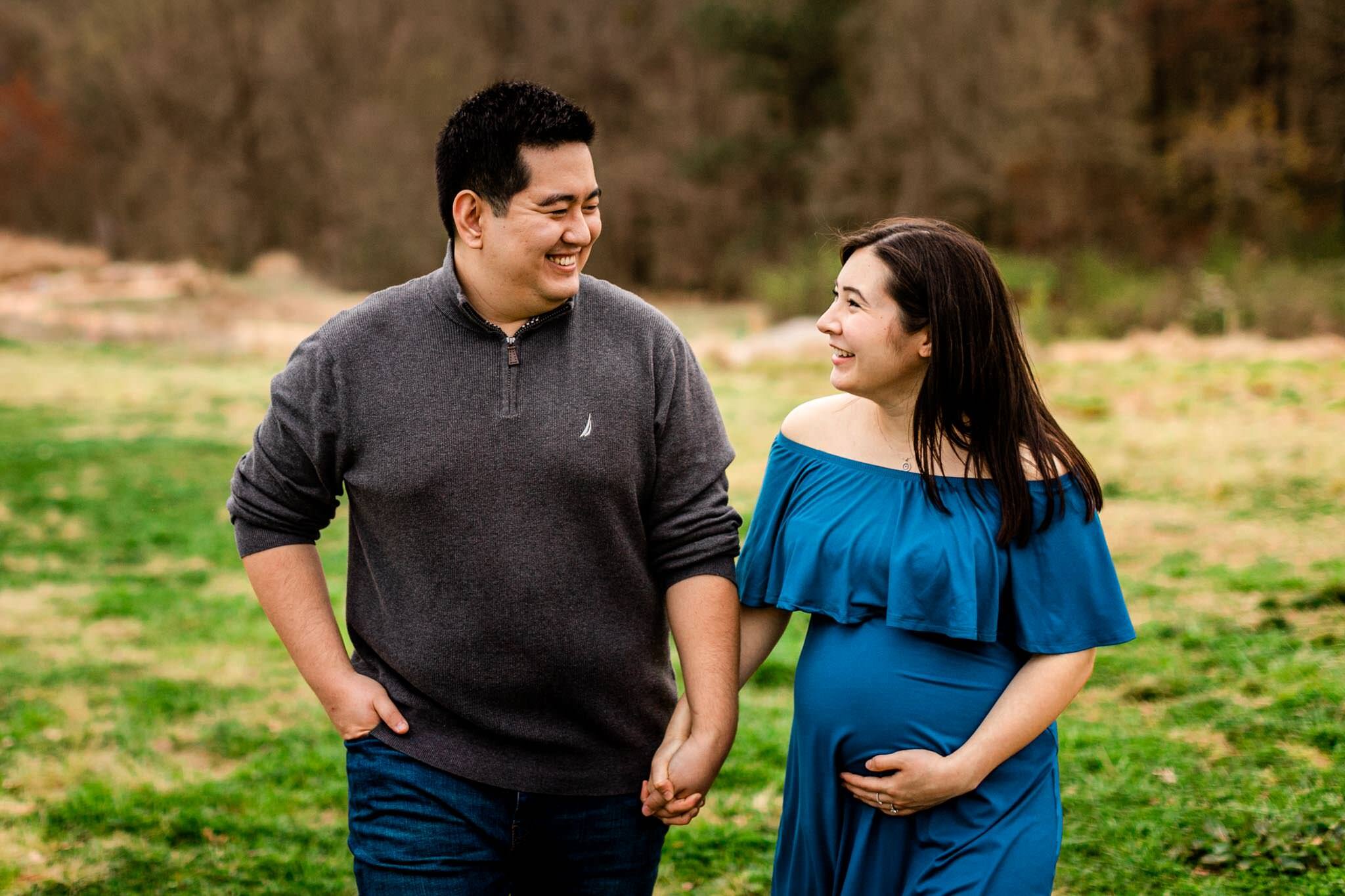 Raleigh Maternity Photographer | By G. Lin Photography | NC Museum of Art | Candid maternity shot of couple walking together