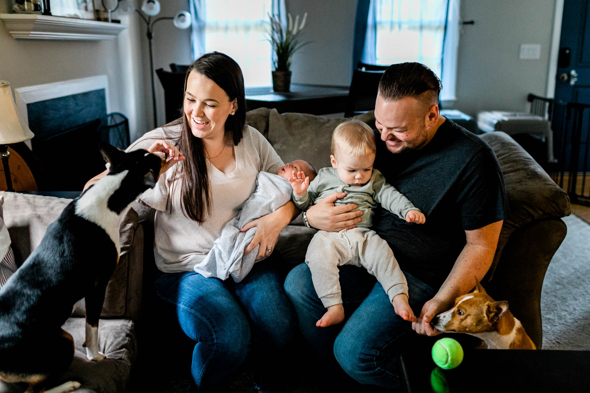 Family sitting on couch | Holly Spring Newborn Photographer | By G. Lin Photography