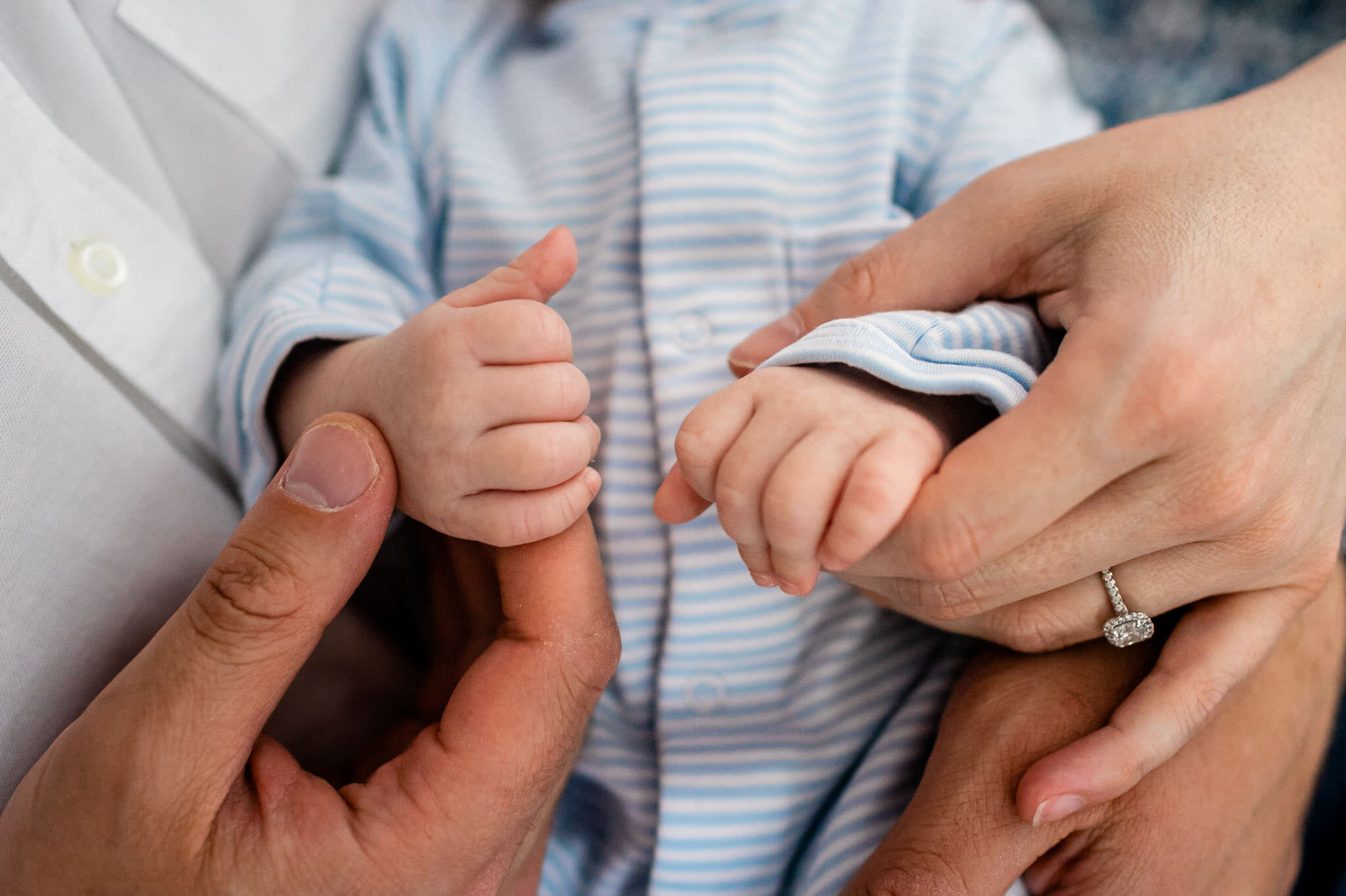 Parents holding baby's hands | Greensboro Newborn Photographer | By G. Lin Photography