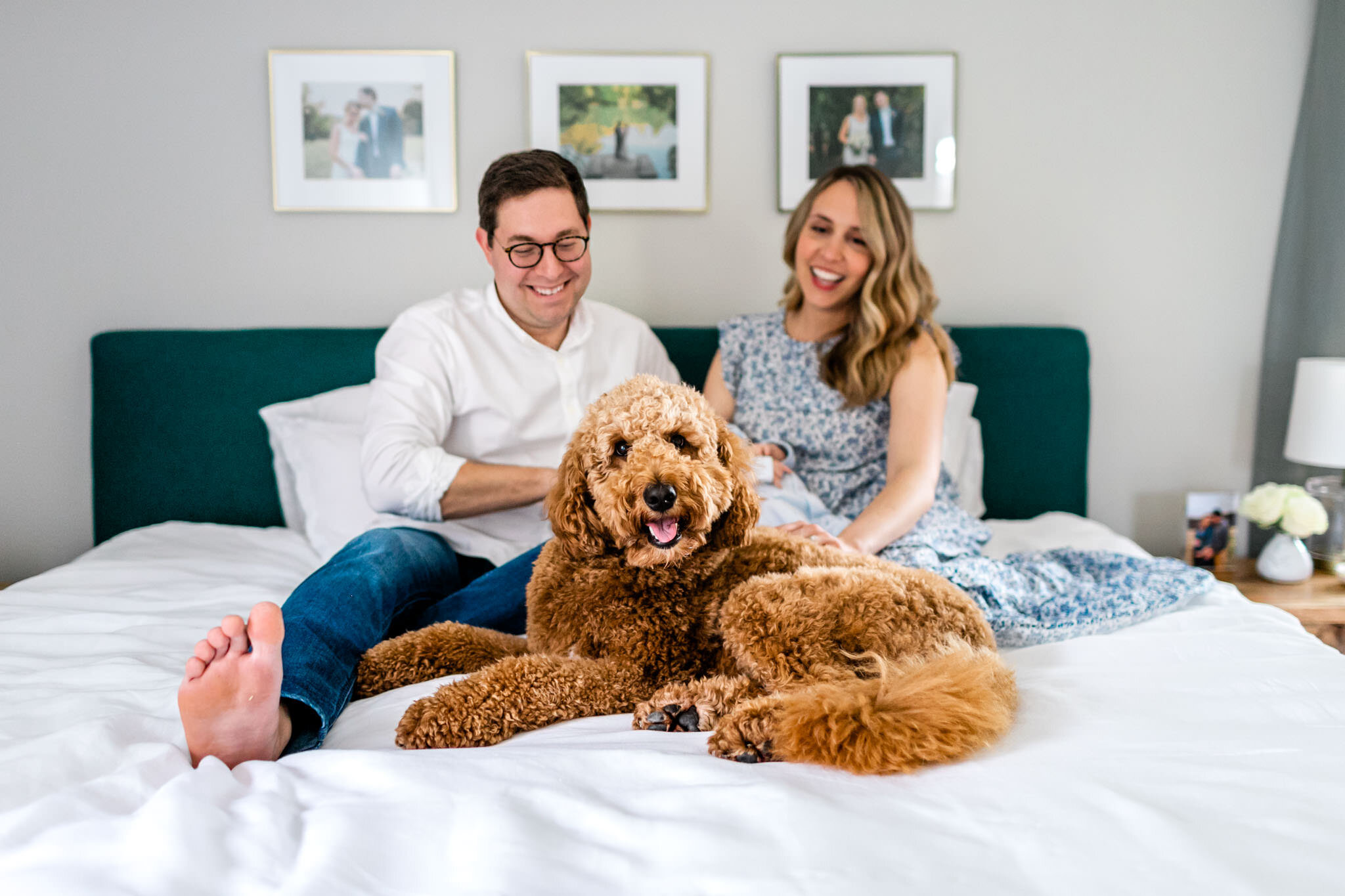 Dog sitting on bed with family | Greensboro Newborn Photographer | By G. Lin Photography