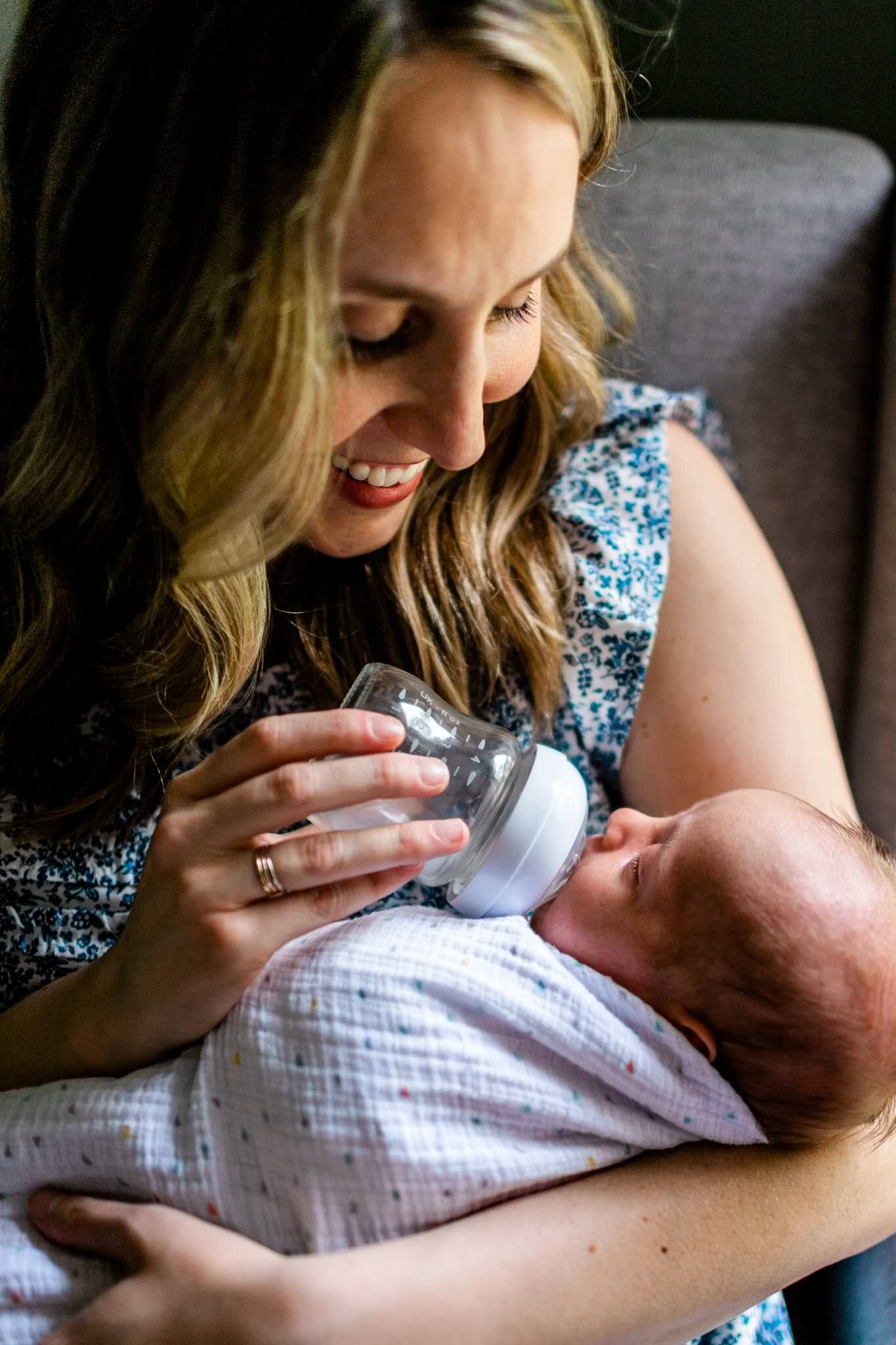 Mother feeding baby | Greensboro Newborn Photographer | By G. Lin Photography