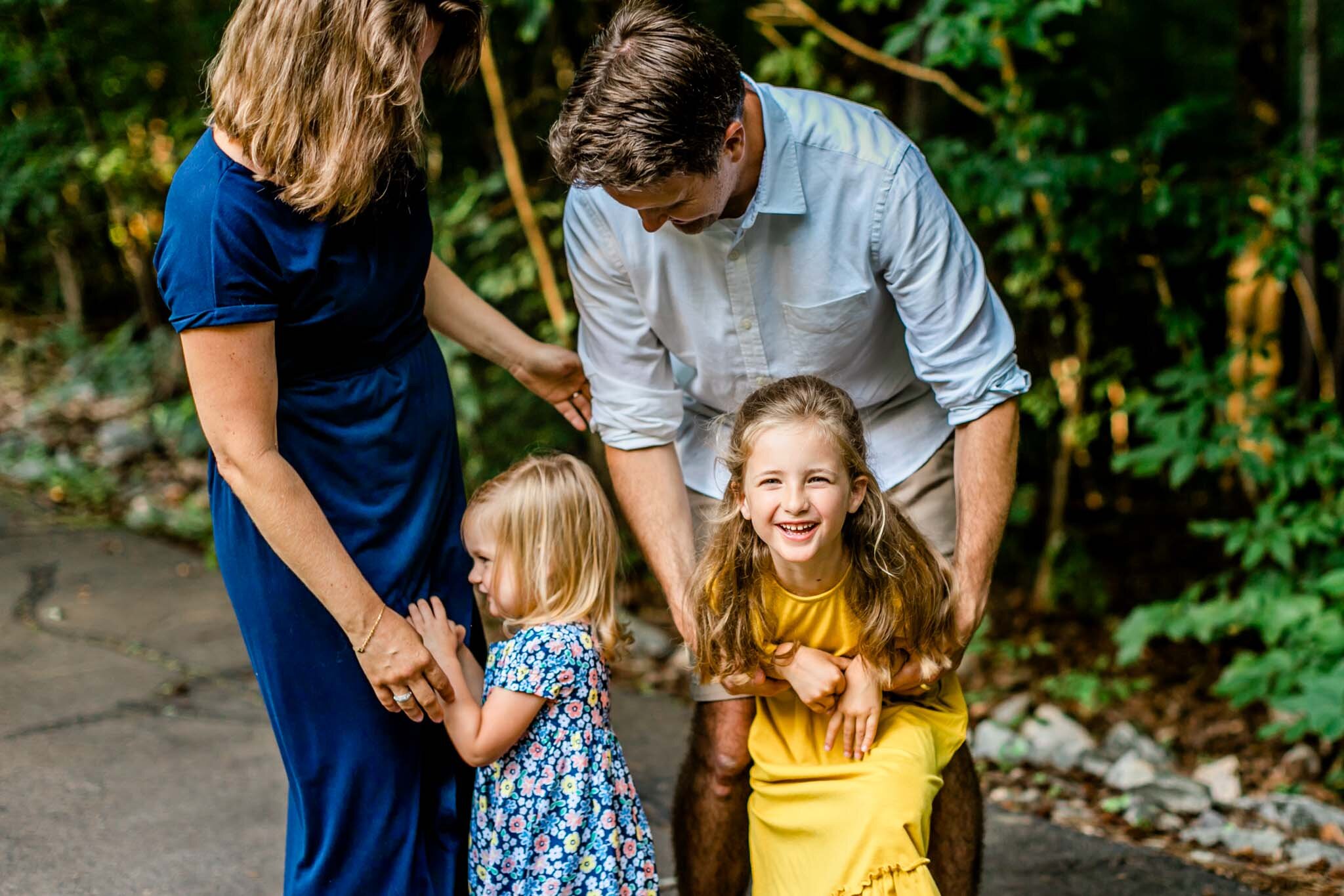 Candid photo of family laughing at North Cary Park | Cary Family Photographer | By G. Lin Photography