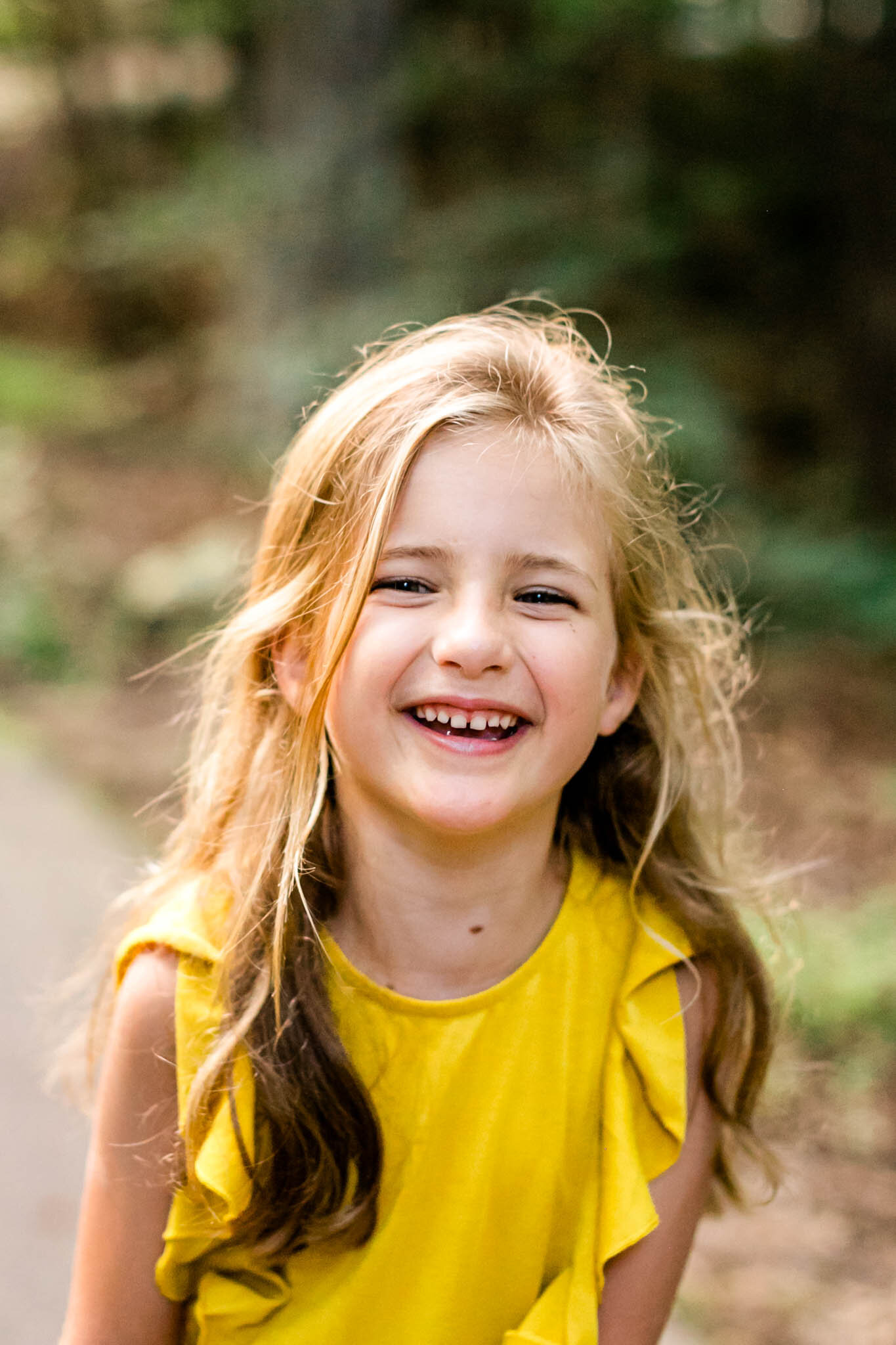 Candid portrait of young girl laughing | Cary Family Photographer | By G. Lin Photography