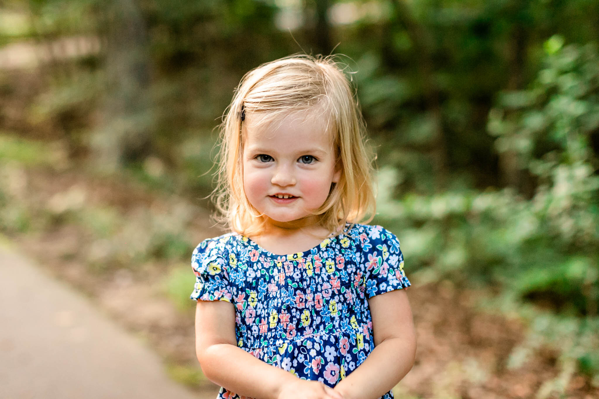 Toddler girl smiling at camera | Cary Family Photographer | By G. Lin Photography