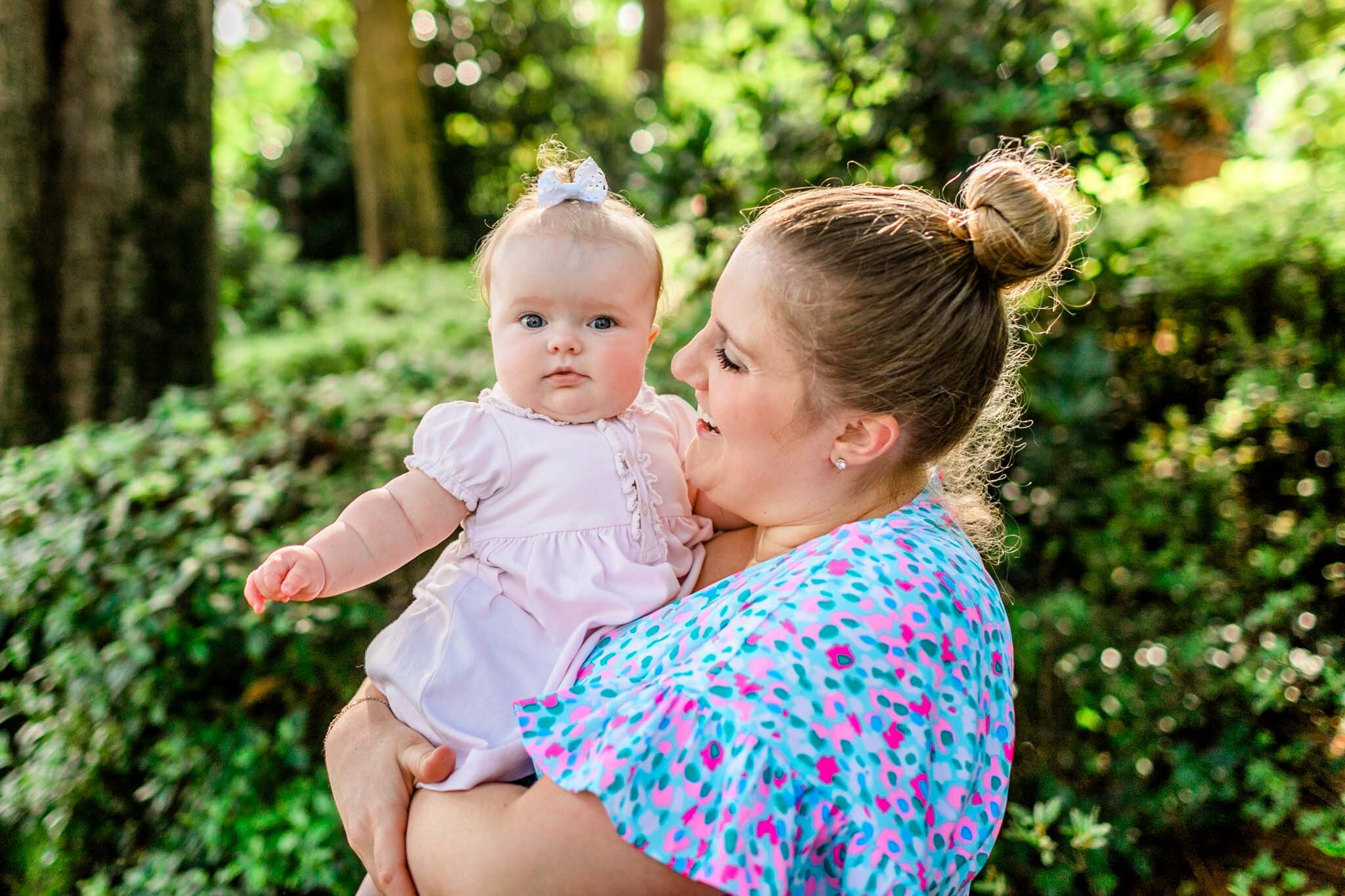 Mother holding baby girl outside | Raleigh Family Photographer | By G. Lin Photography | WRAL Azalea Garden