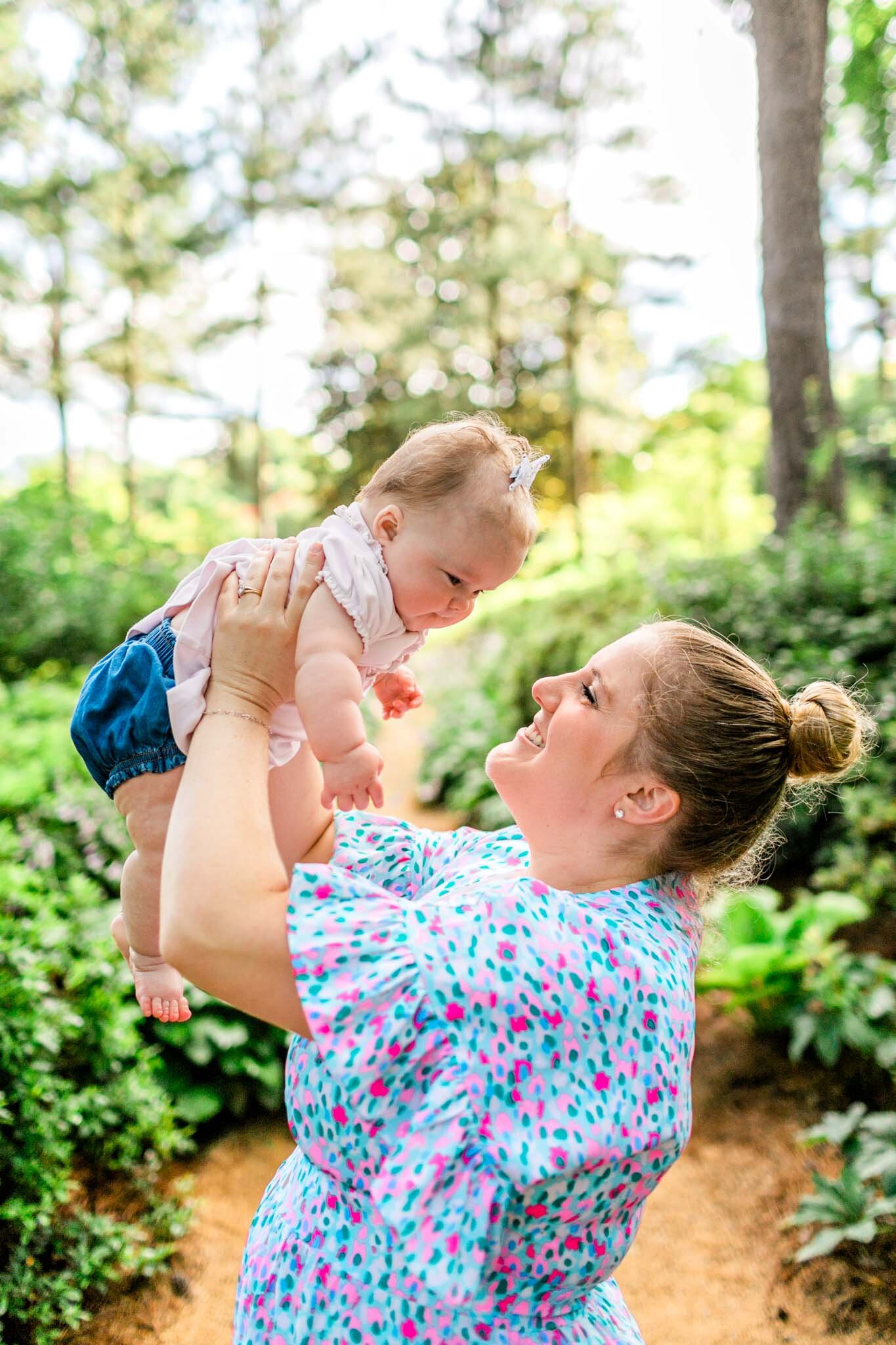 Mom holding daughter in the air | Raleigh Family Photographer | By G. Lin Photography | WRAL Azalea Garden