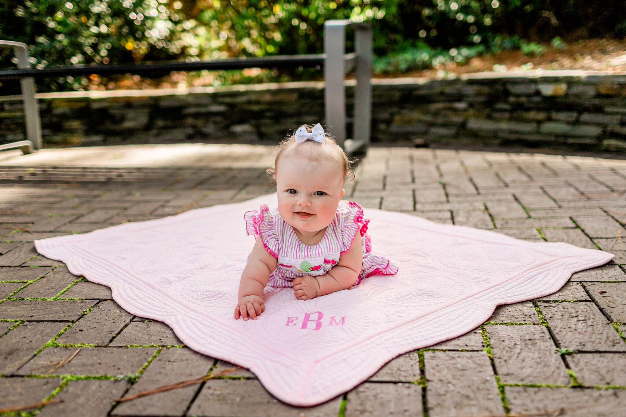 Baby girl doing tummy time on pink blanket | Raleigh Family Photographer | By G. Lin Photography | WRAL Azalea Garden