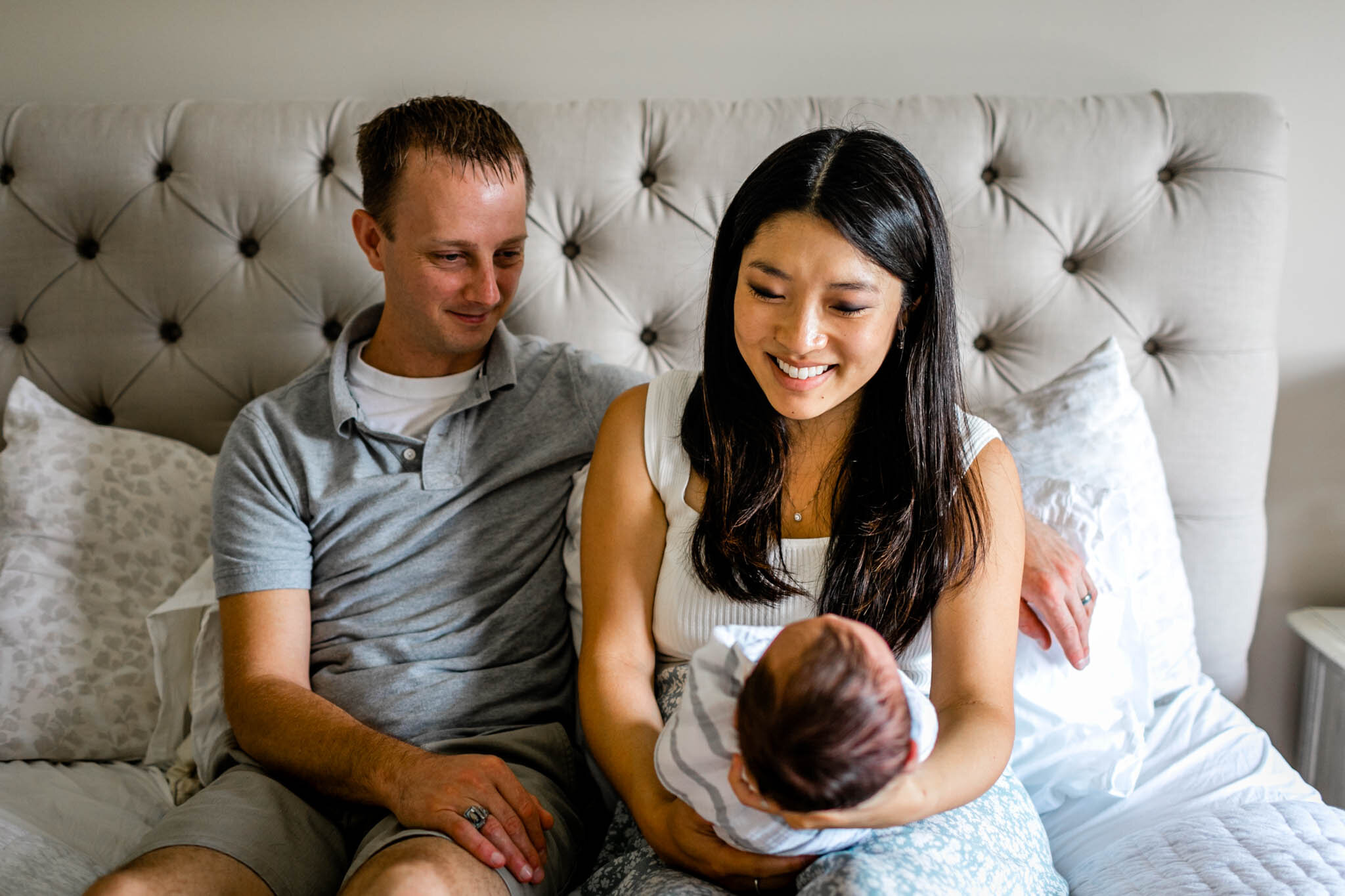 Couple smiling at baby | Durham Newborn Photographer | By G. Lin Photography