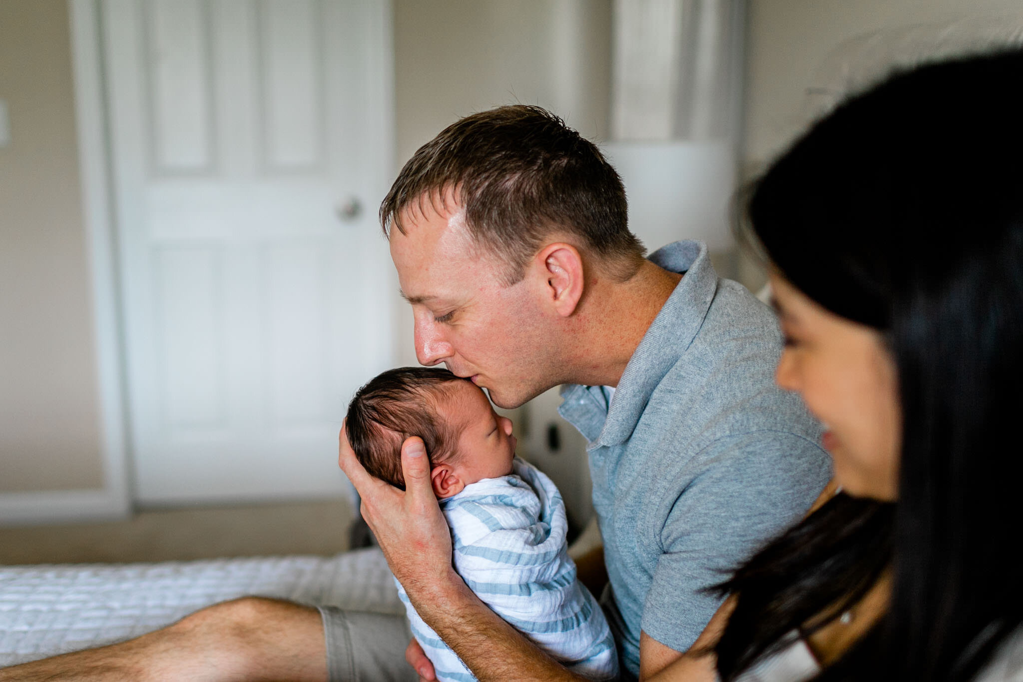 Father kissing baby boy | Durham Newborn Photographer | By G. Lin Photography